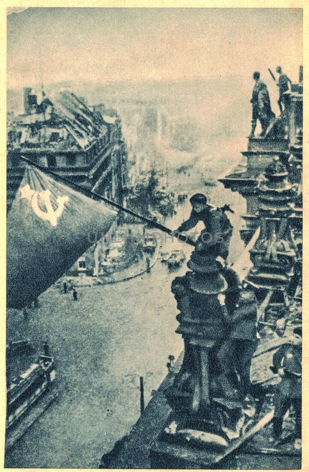 BERLIN, GERMANY - MAY 2, 1945: Raising a Flag over the Reichstag, a photograph taken during the Battle of Berlin on 2 May 1945