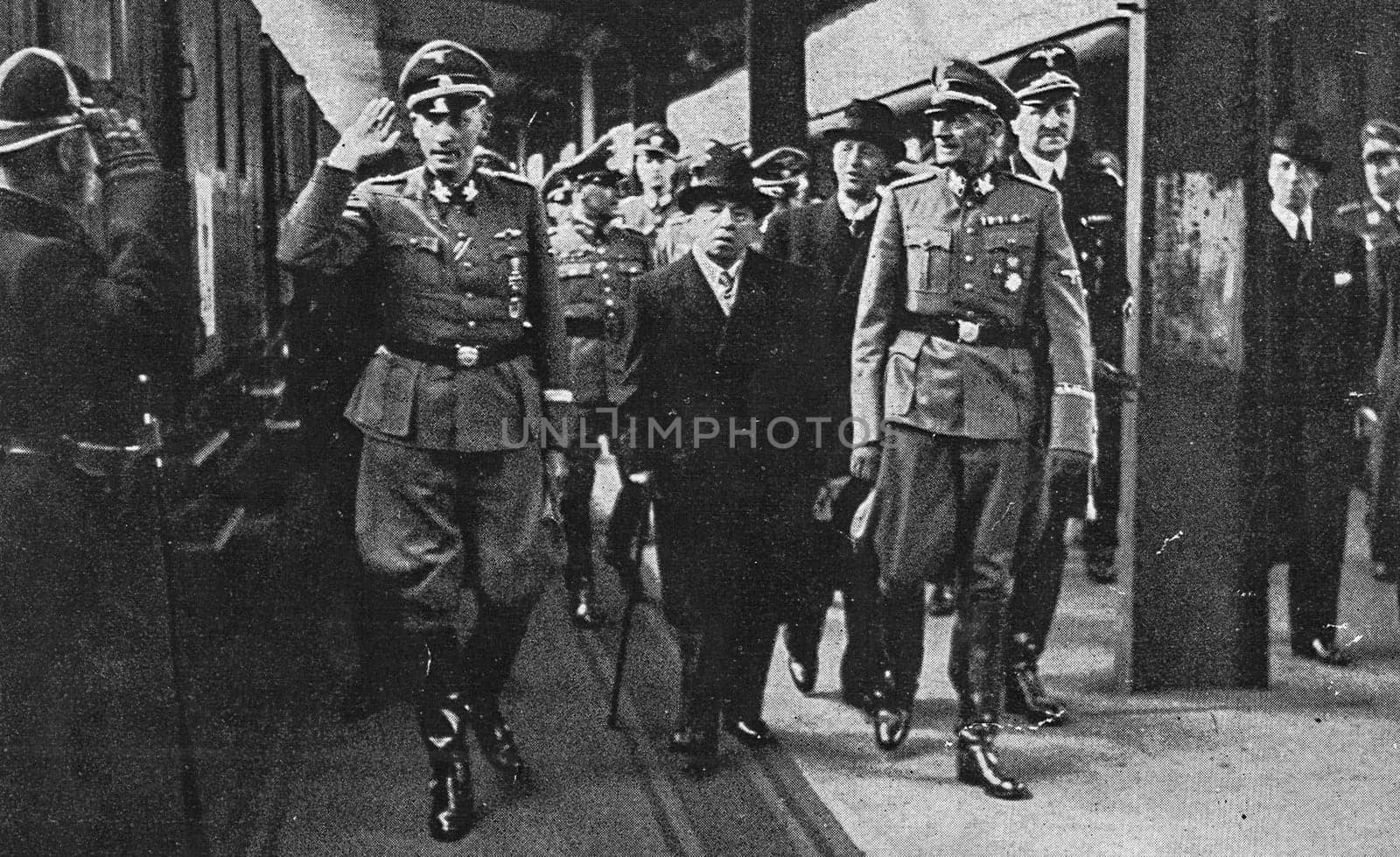 PRAGUE, PROTECTORATE OF BOHEMIA AND MORAVIA - APRIL 20, 1942: The Deputy Reich Protector Obergruppenf hrer Reinhard Heydrich, president Emil Hacha and then State Secretary Gruppenf hrer Karl Hermann Frank. On the day of Adolf Hitler's 53rd birthday, on April 20, 1942, State President Emil H cha presented a gift from the Protectorate of Bohemia and Moravia to Hitler at the Central Station in Prague