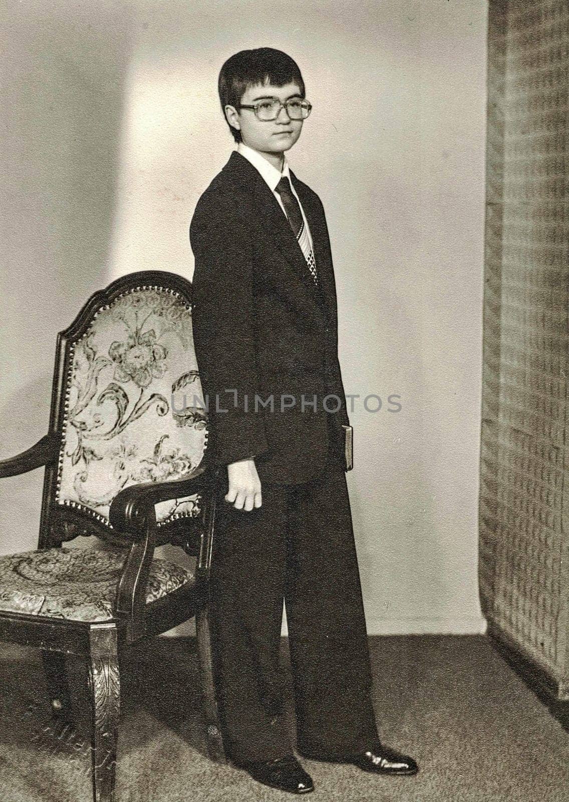 ZWICKAU, EAST GERMANY - CIRCA 1970s: The retro photo shows young boy,circa 15 years old. Studio photo. Black and white photo.