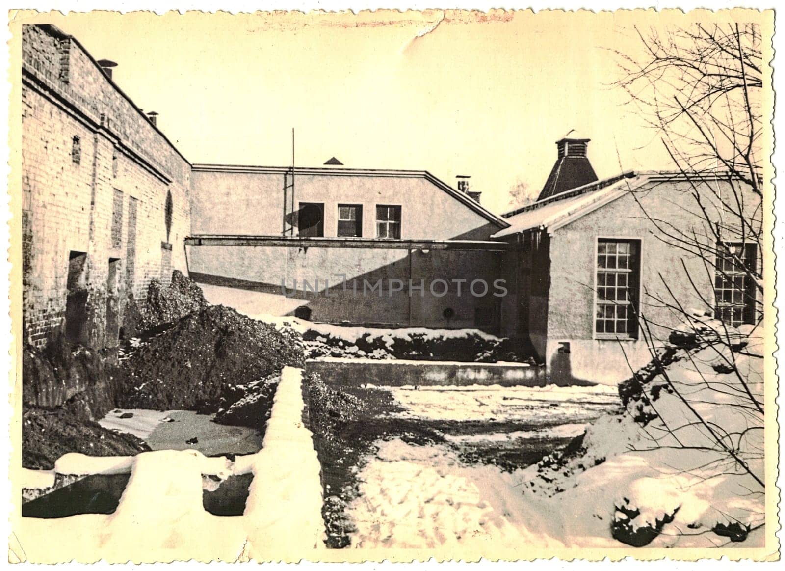 The retro photo shows old industry zone in former East Germany. Black and white photo. by roman_nerud