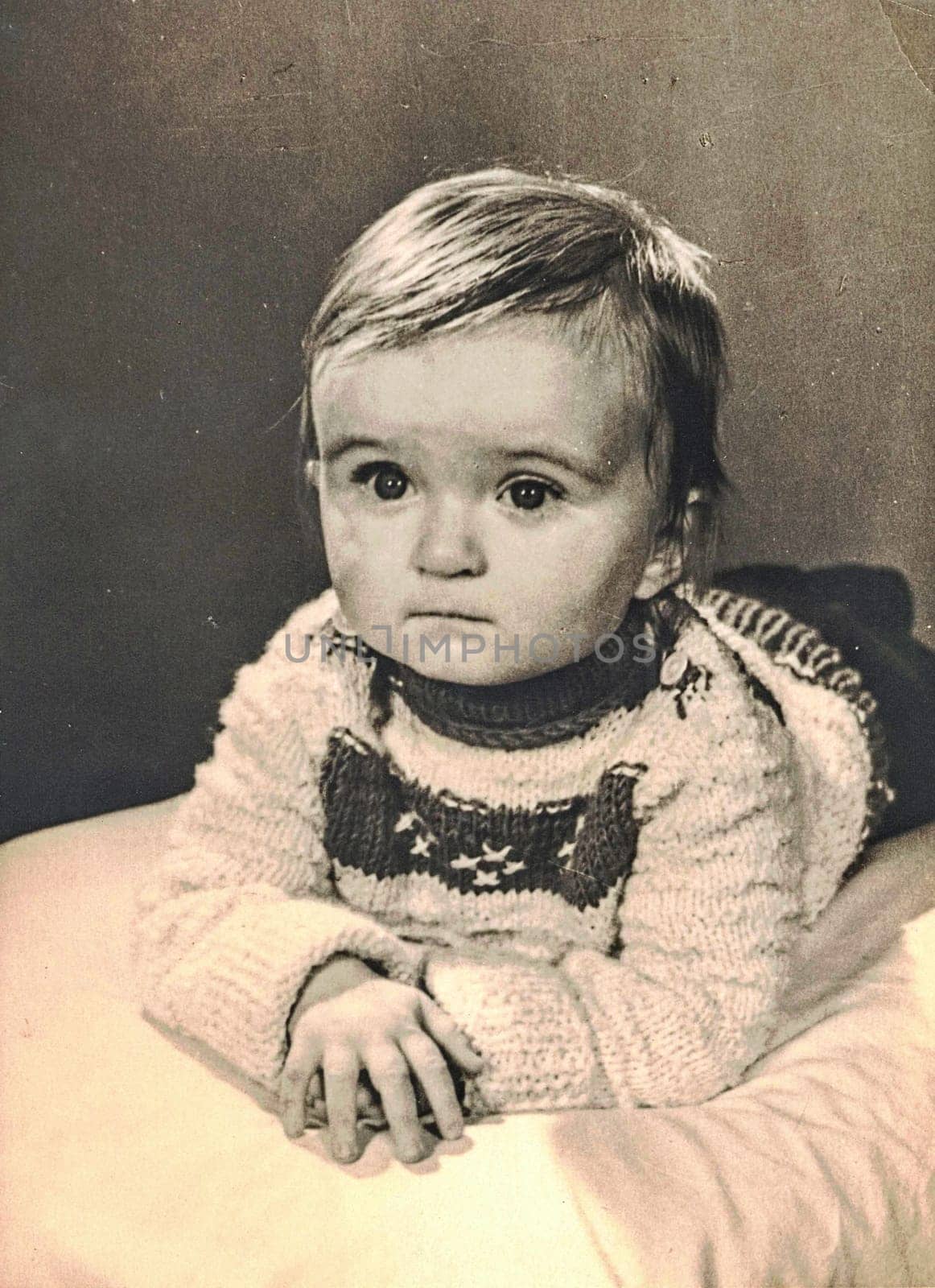 ZWICKAU, EAST GERMANY - CIRCA 1970s: The retro photo shows baby boy,circa 1 year old. Studio photo. Black and white photo.