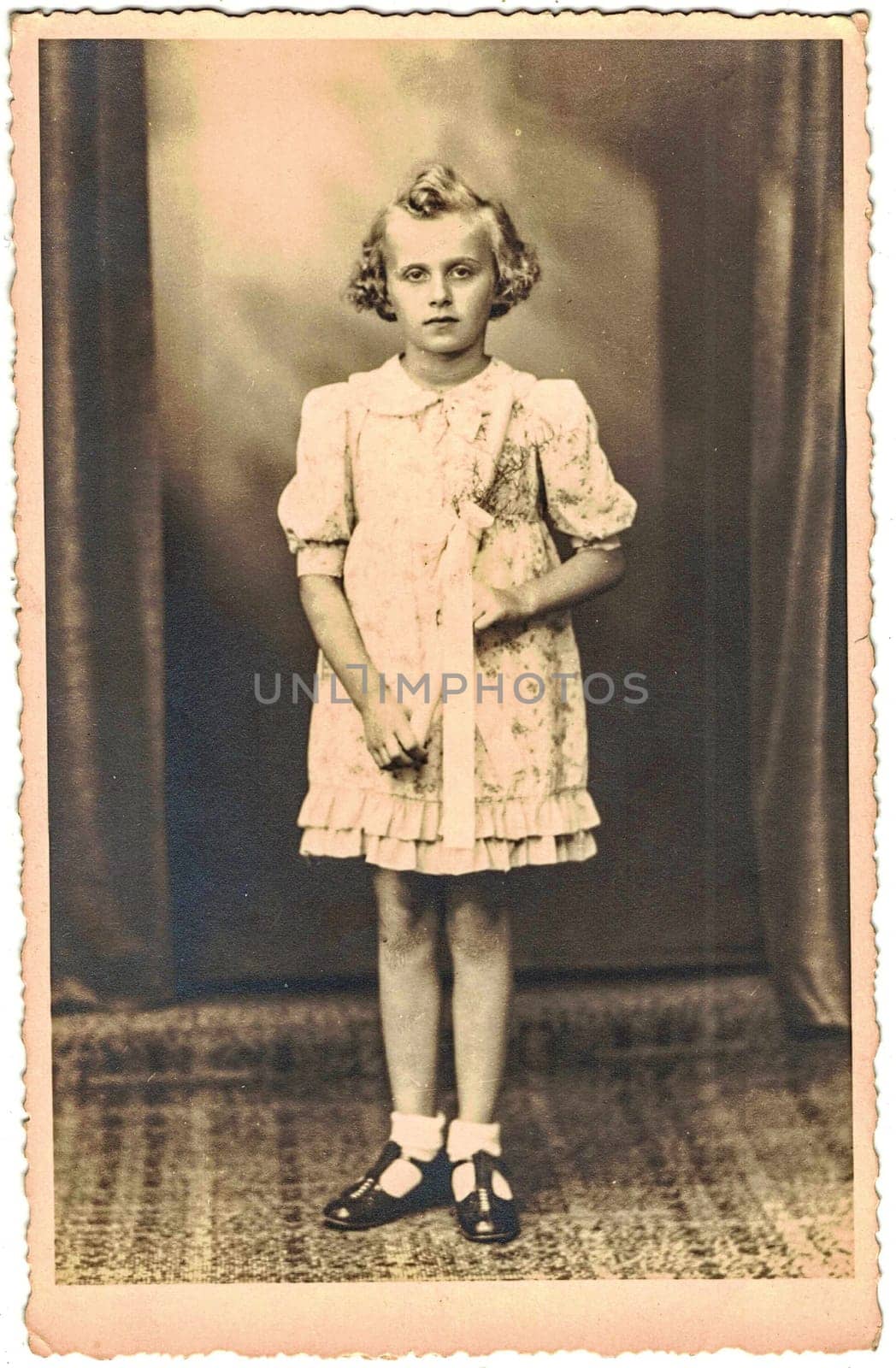 Retro photo shows girl and her first communion. Black & white vintage photography. Studio portrait. by roman_nerud