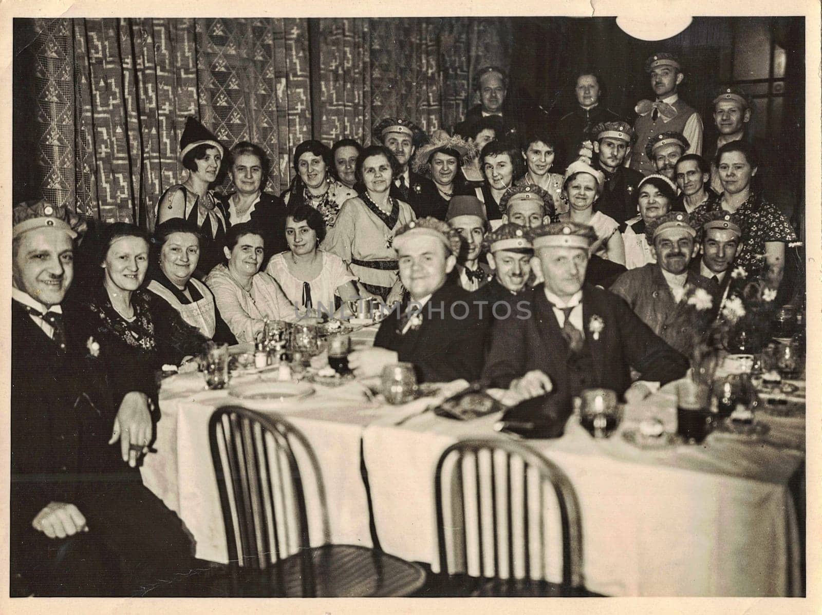 Retro photo shows social event - celebrating of New Year's Eve. Circa 1950s. by roman_nerud