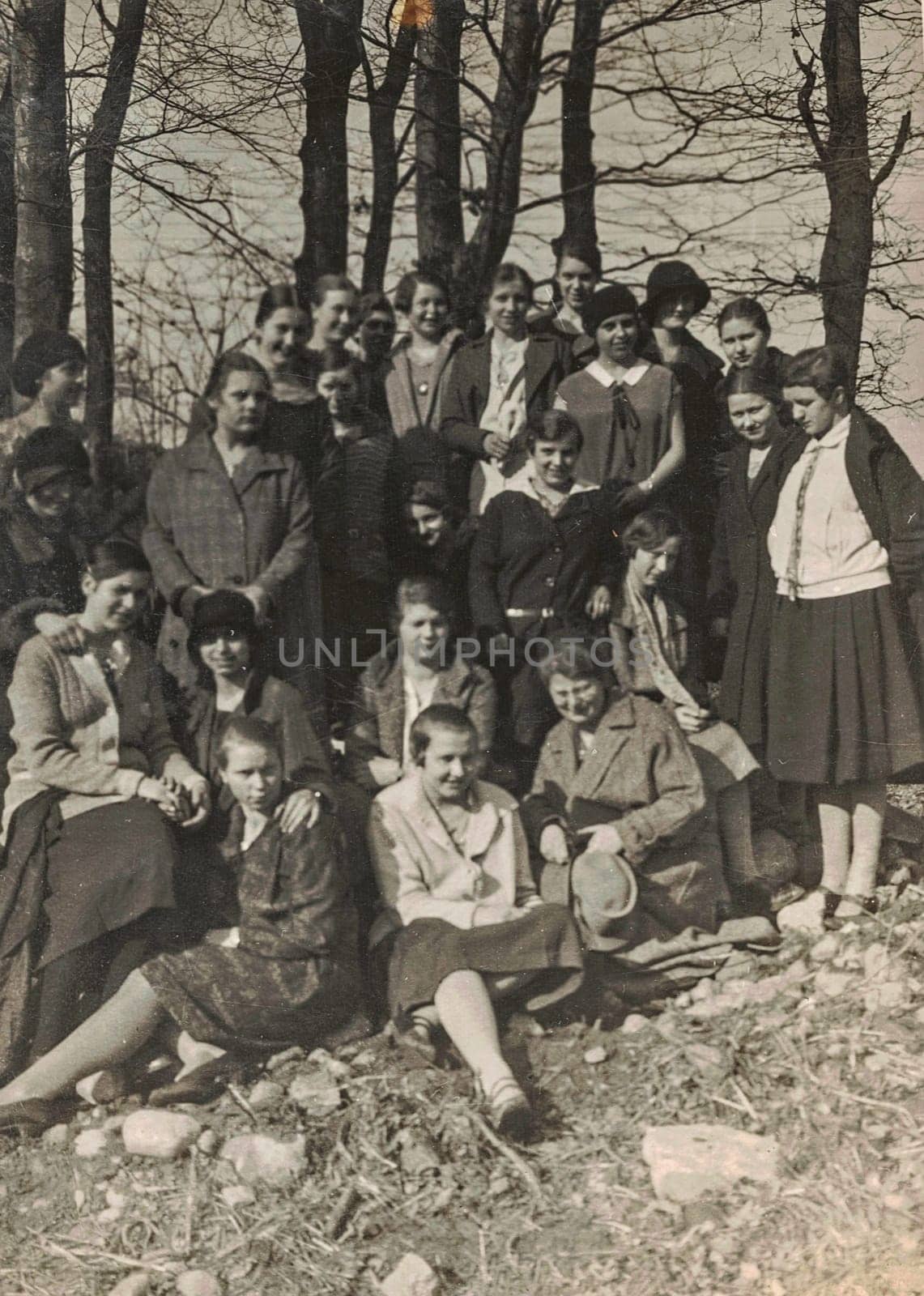 Vintage photo shows group of girls pose outdoors. Black and white photo. Circa 1930s. by roman_nerud