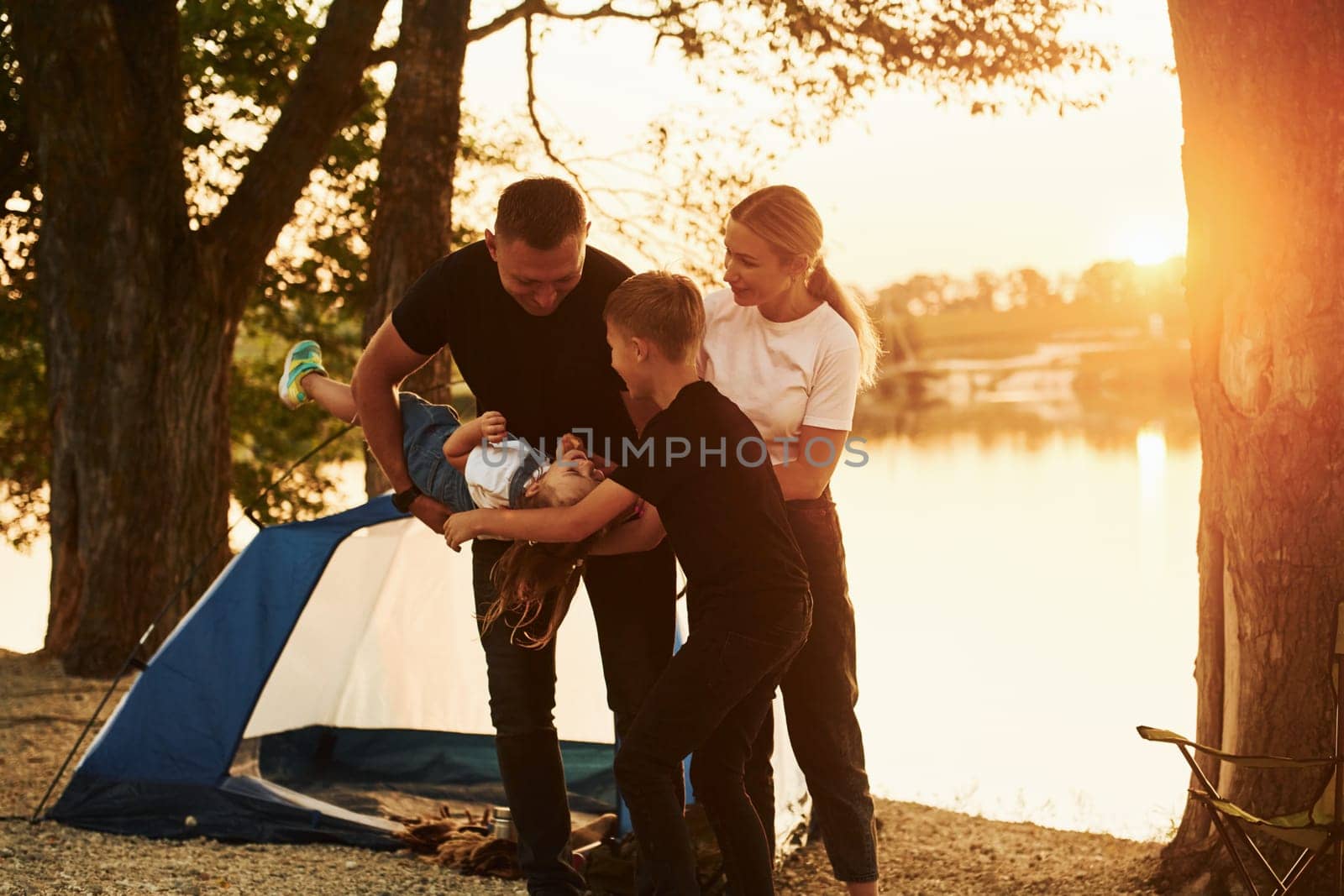 Family of mother, father and kids is on the camping by Standret