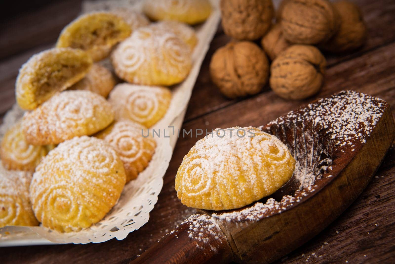 Traditional eid maamoul or mamoul cookies with dates, nuts, and jam, Arabic sweets for Aid al-Fitr and easter, High quality photo