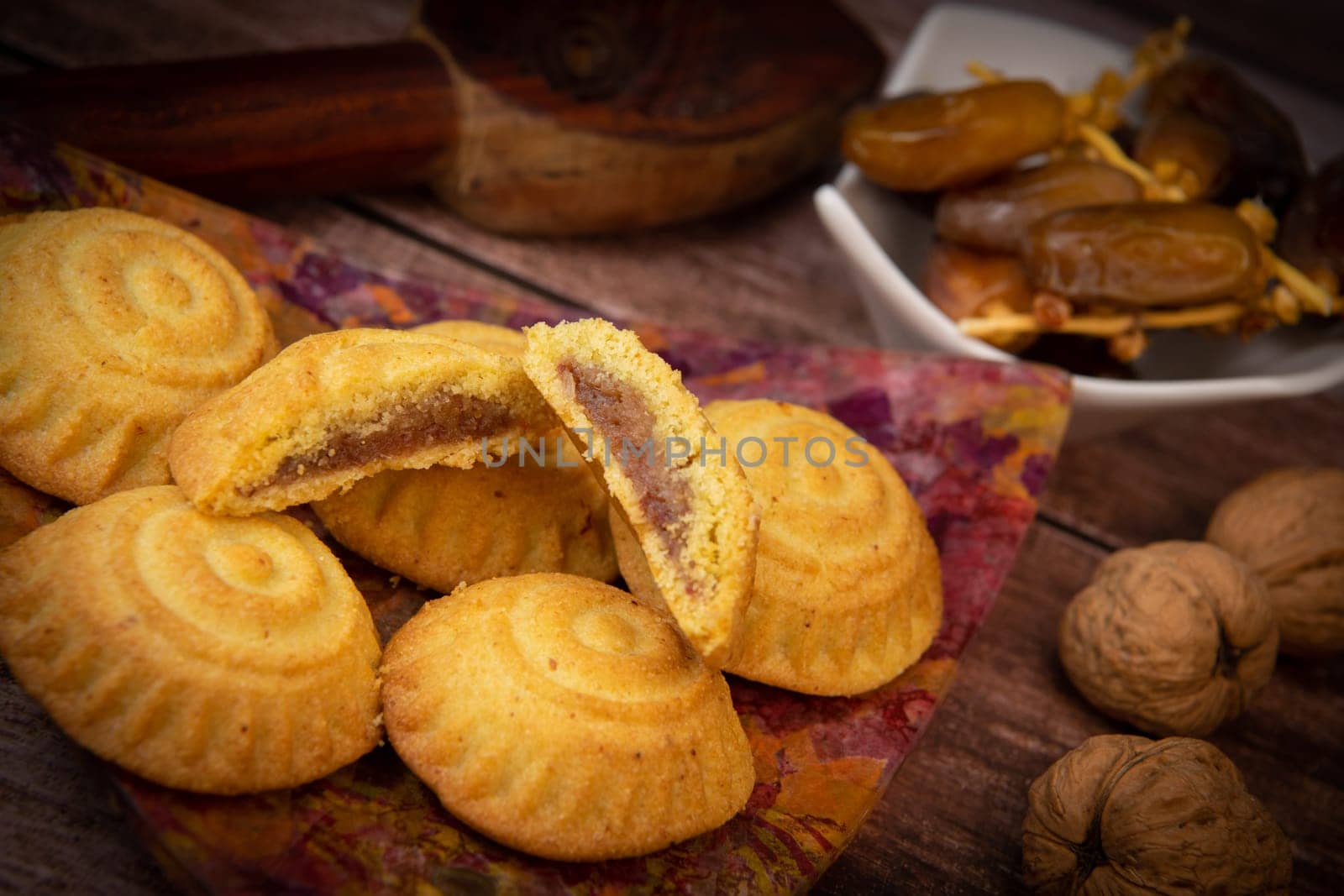 Traditional eid maamoul or mamoul cookies with dates, nuts, and jam, Arabic sweets for Aid al-Fitr and easter, High quality photo