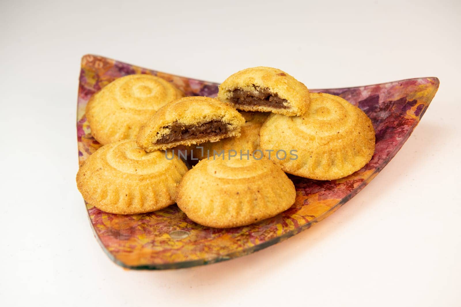 Traditional eid maamoul or mamoul cookies with dates, nuts, and jam, Arabic sweets for Aid al-Fitr and easter, High quality photo