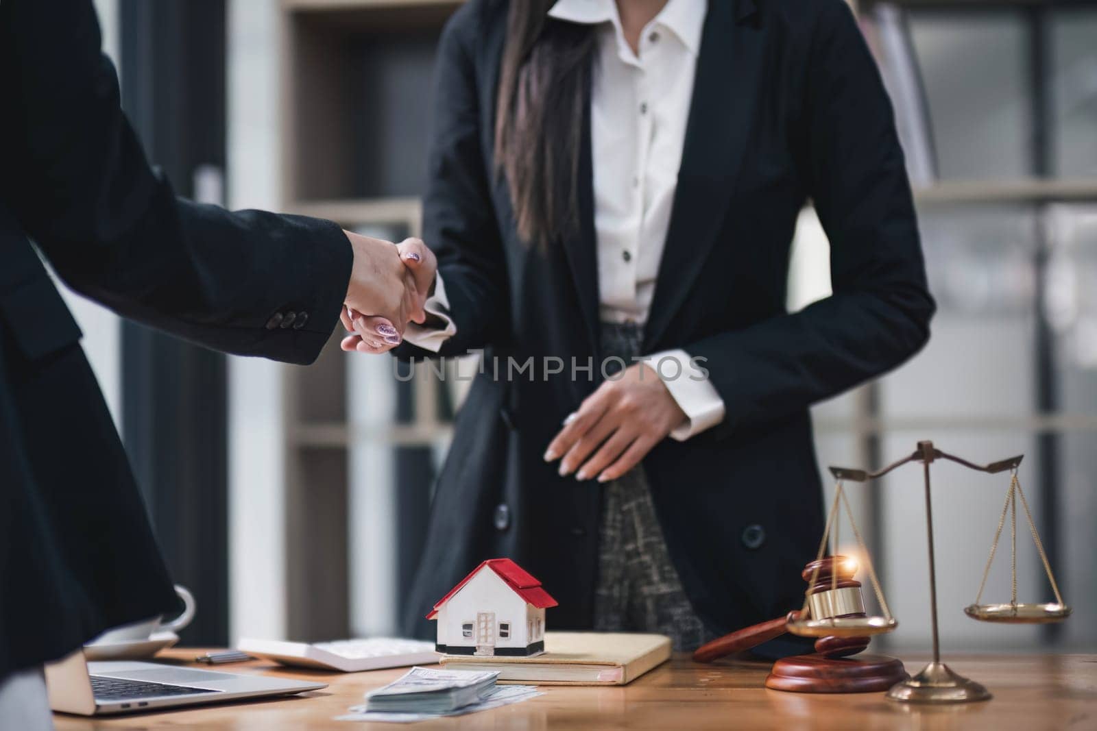 Handshake of cooperation customer and saleswoman after agreement, successful car loan contract buying or selling new vehicle...