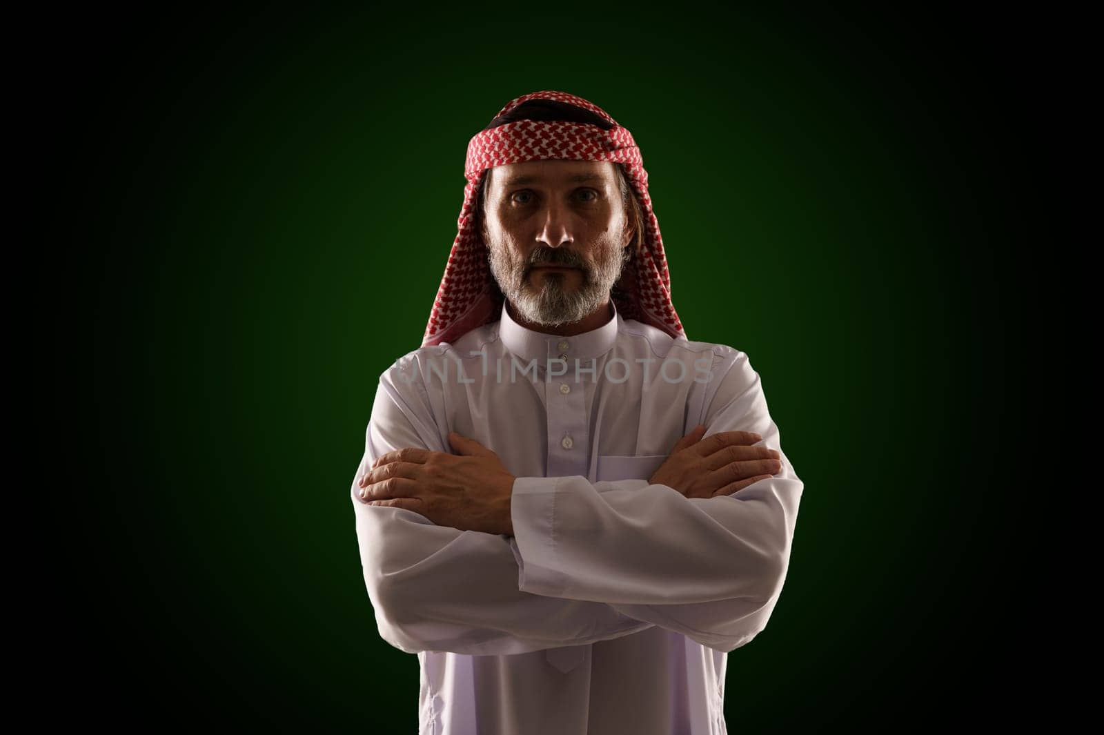 Arab man in traditional Islamic clothing and immersed in Sharia culture, with emphasis on religious customs, architecture, and lifestyle. Essence of Middle Eastern heritage, history, and spirituality. by LipikStockMedia