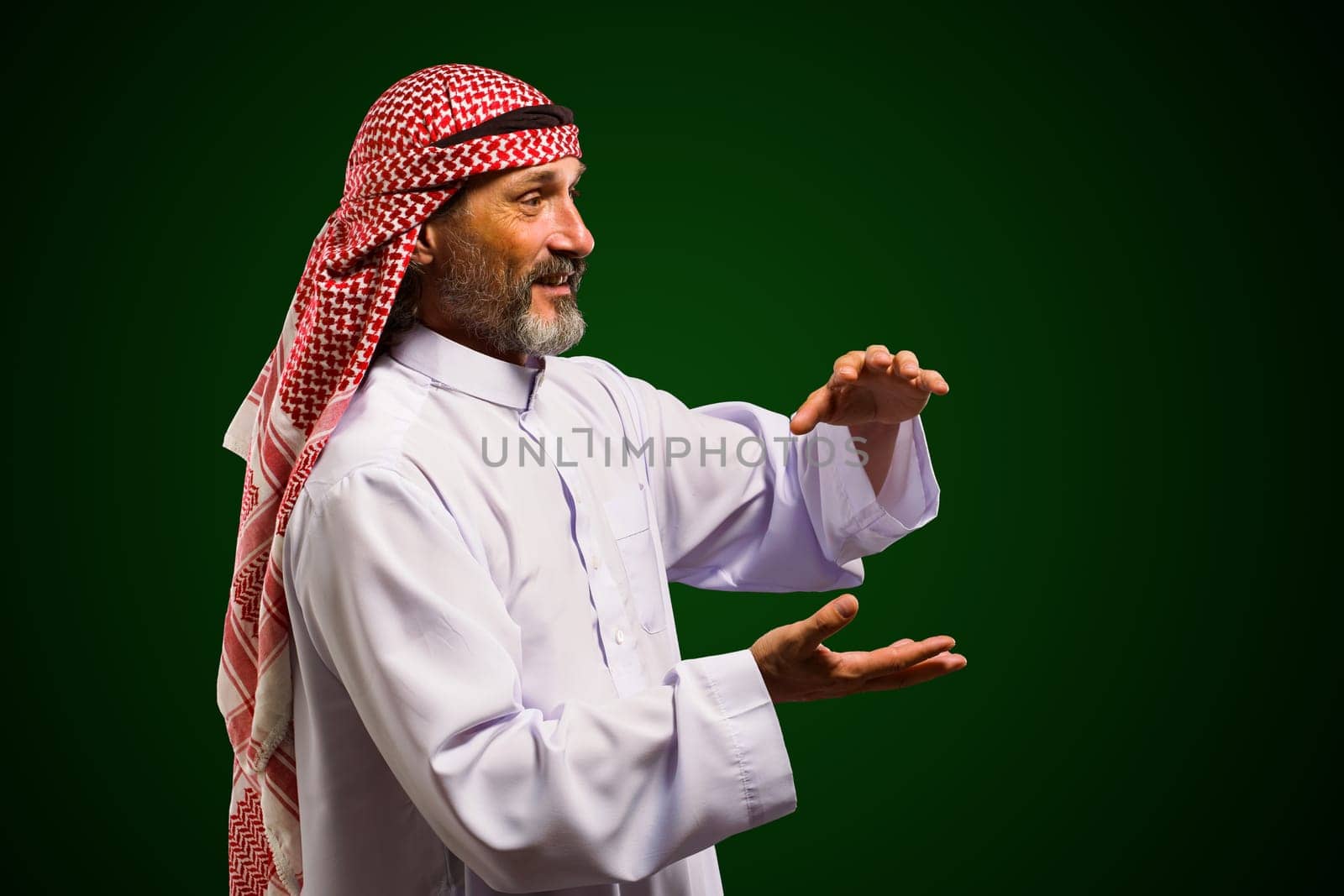 Arab sorcerer forming energy ball with his hands, performs mystical ritual. Mystical and supernatural aspects of traditional Arab spiritual practices. High quality photo