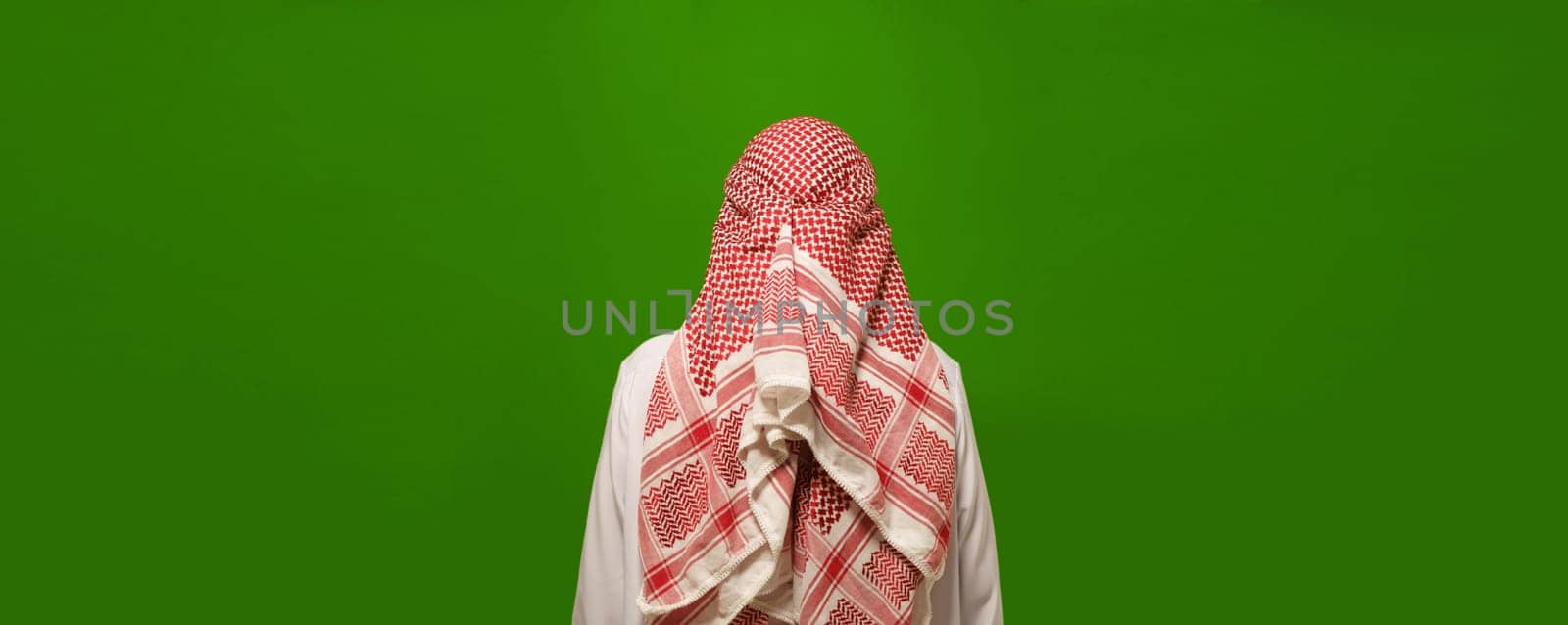 reverse side of Islam, using back view of man in Arabic clothes. hidden and unknown aspects of Islamic culture, inviting viewer to explore enigmatic and spiritual dimensions of religion. High quality photo
