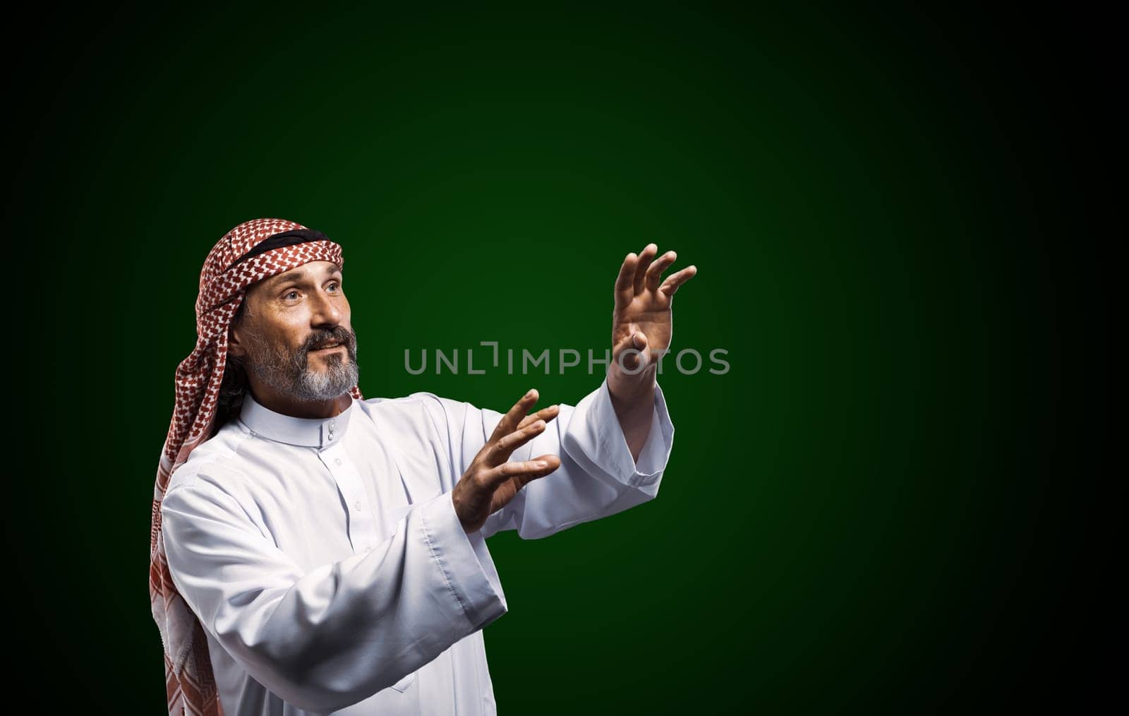 Arab healer performs energy work using hands, channeling spiritual forces for holistic well-being and relaxation. High quality photo