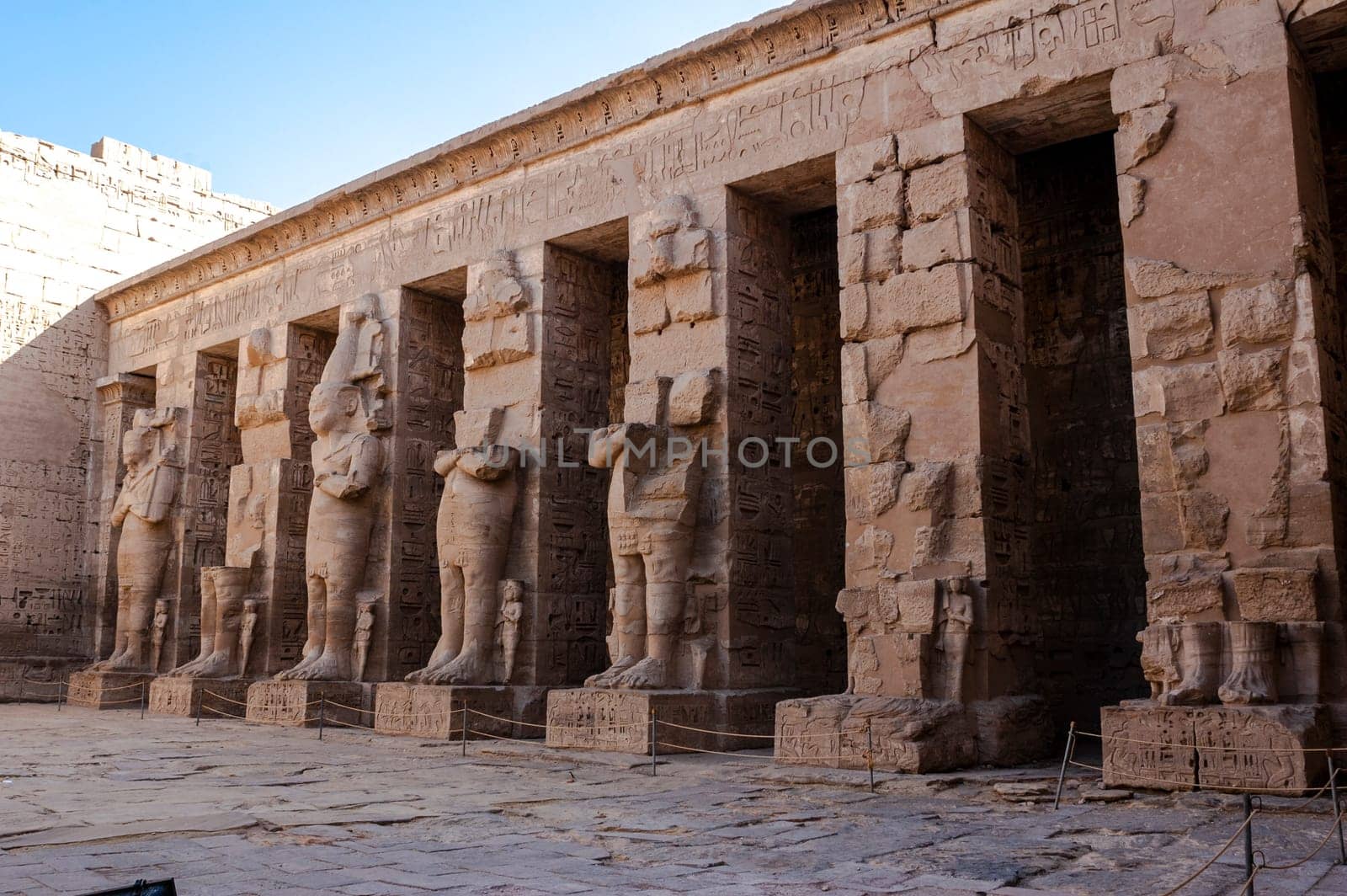 Luxor, Egypt - April 16 2008: The funerary temple of Ramses II in the archaeological site of Medinet Habu, Luxor, Egypt