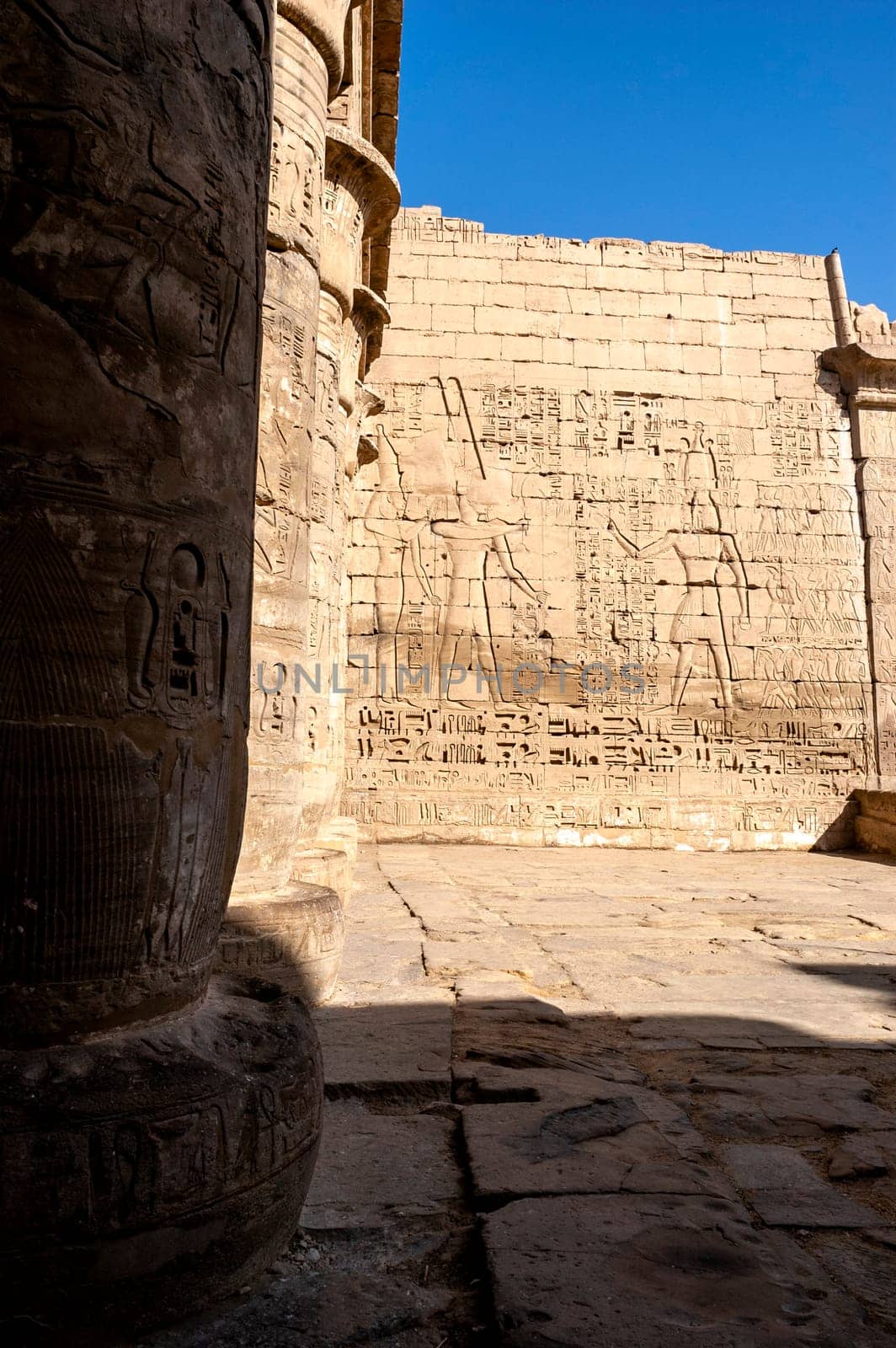 Luxor, Egypt - April 16 2008: The funerary temple of Ramses II in the archaeological site of Medinet Habu, Luxor, Egypt