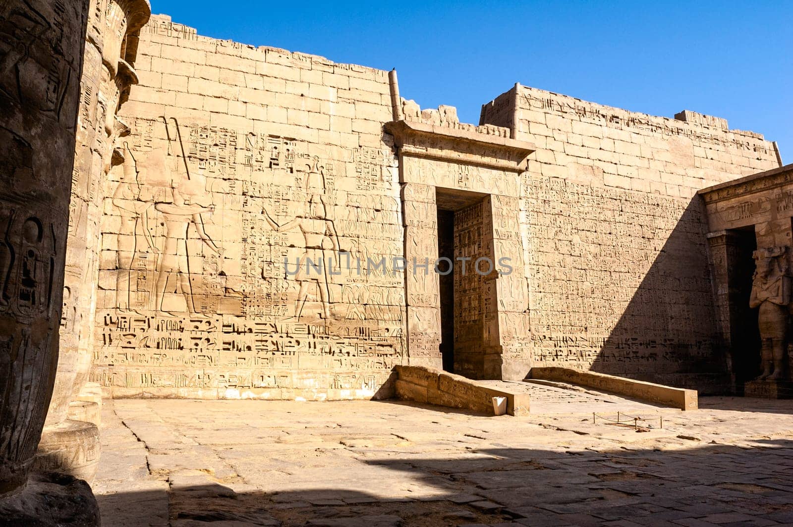 Luxor, Egypt - April 16 2008: The funerary temple of Ramses II in the archaeological site of Medinet Habu, Luxor, Egypt