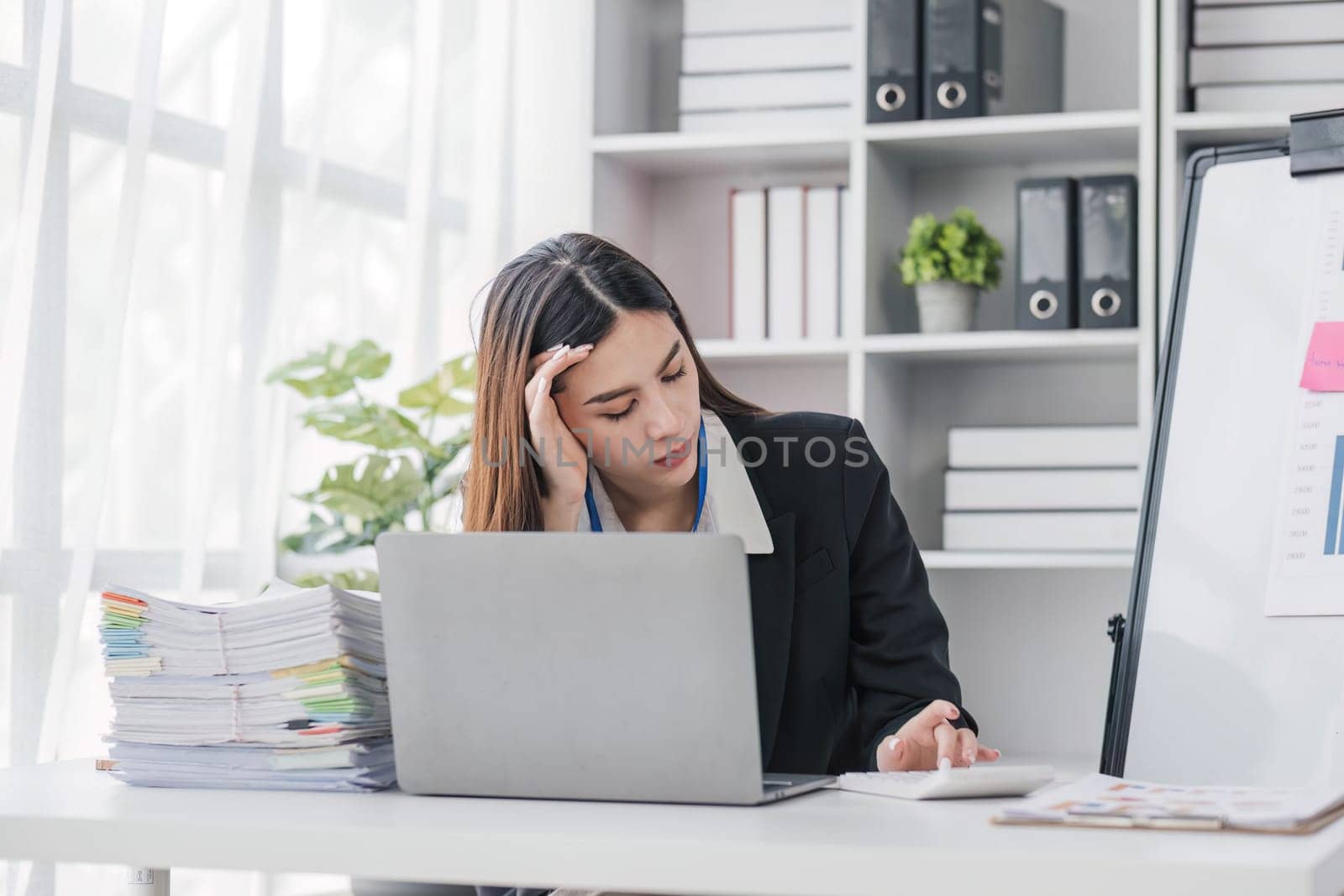 asian woman thinking hard concerned about online problem solution looking at laptop screen, worried serious asian businesswoman focused on solving difficult work computer task...