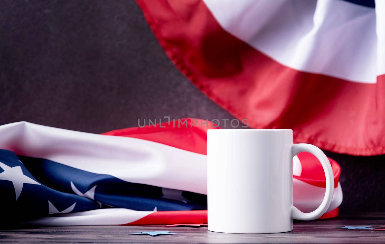 Blank white cup for mockup design over USA flag background by Desperada