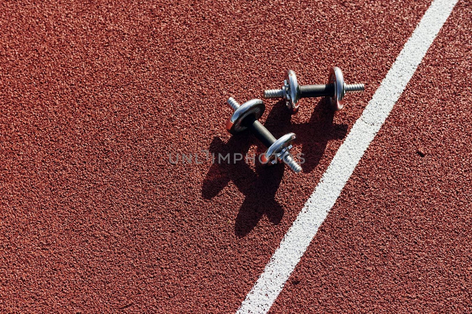 Top view of dumbbells that is on the ground.