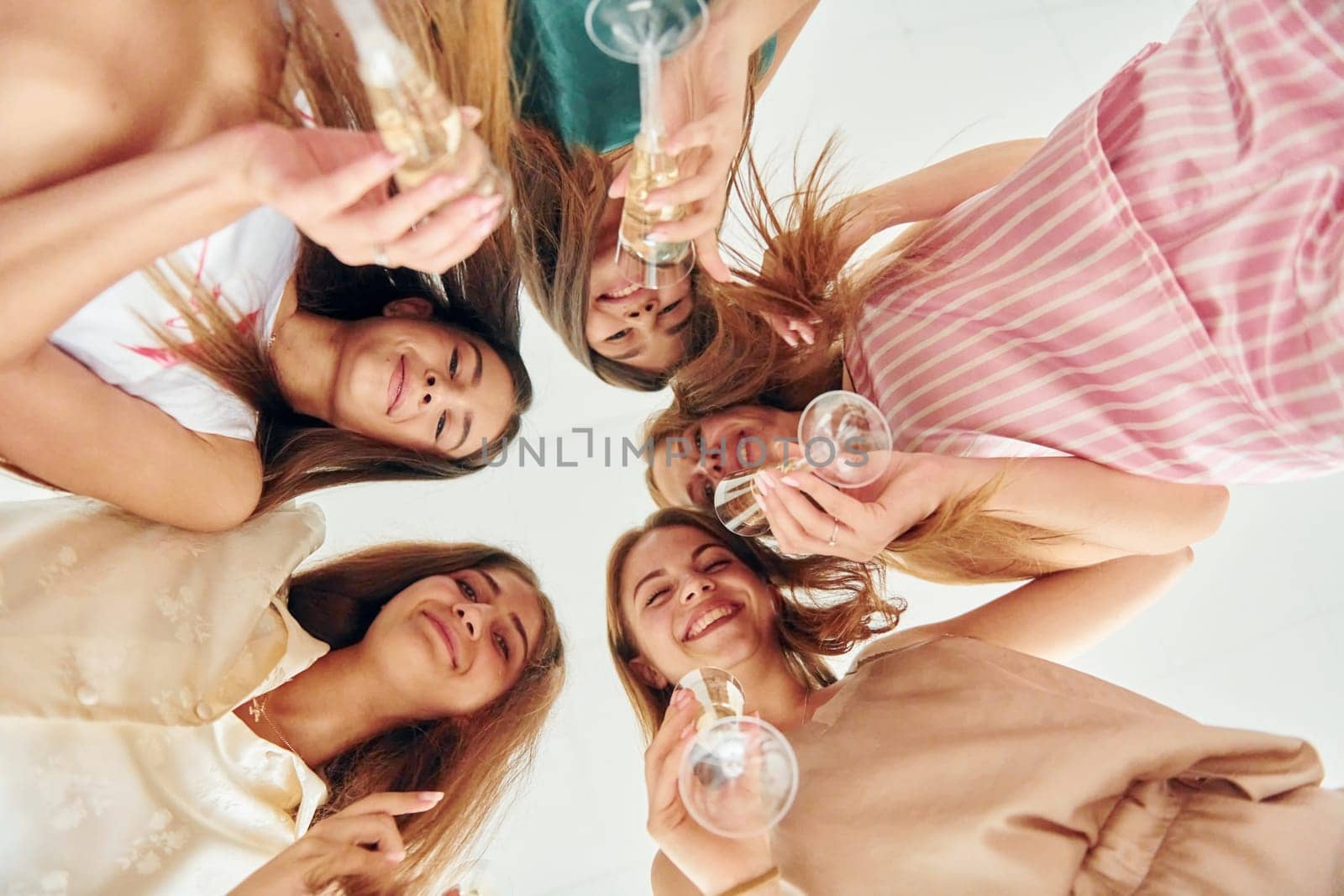 Having fun. Group of happy women that is at a bachelorette party.