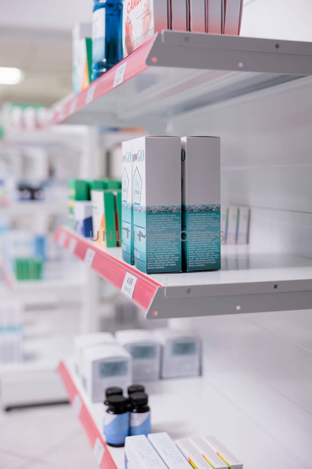 Selective focus of drugstore shelves filled with vitamins and pharmaceutical products to sell prescription medicine by DCStudio