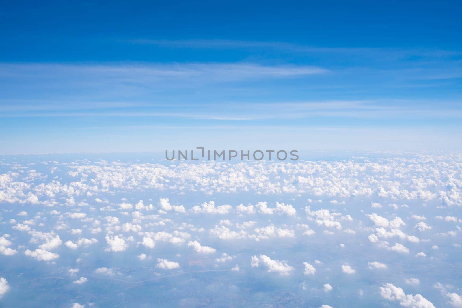 Cloud texture and blue sky by airplane