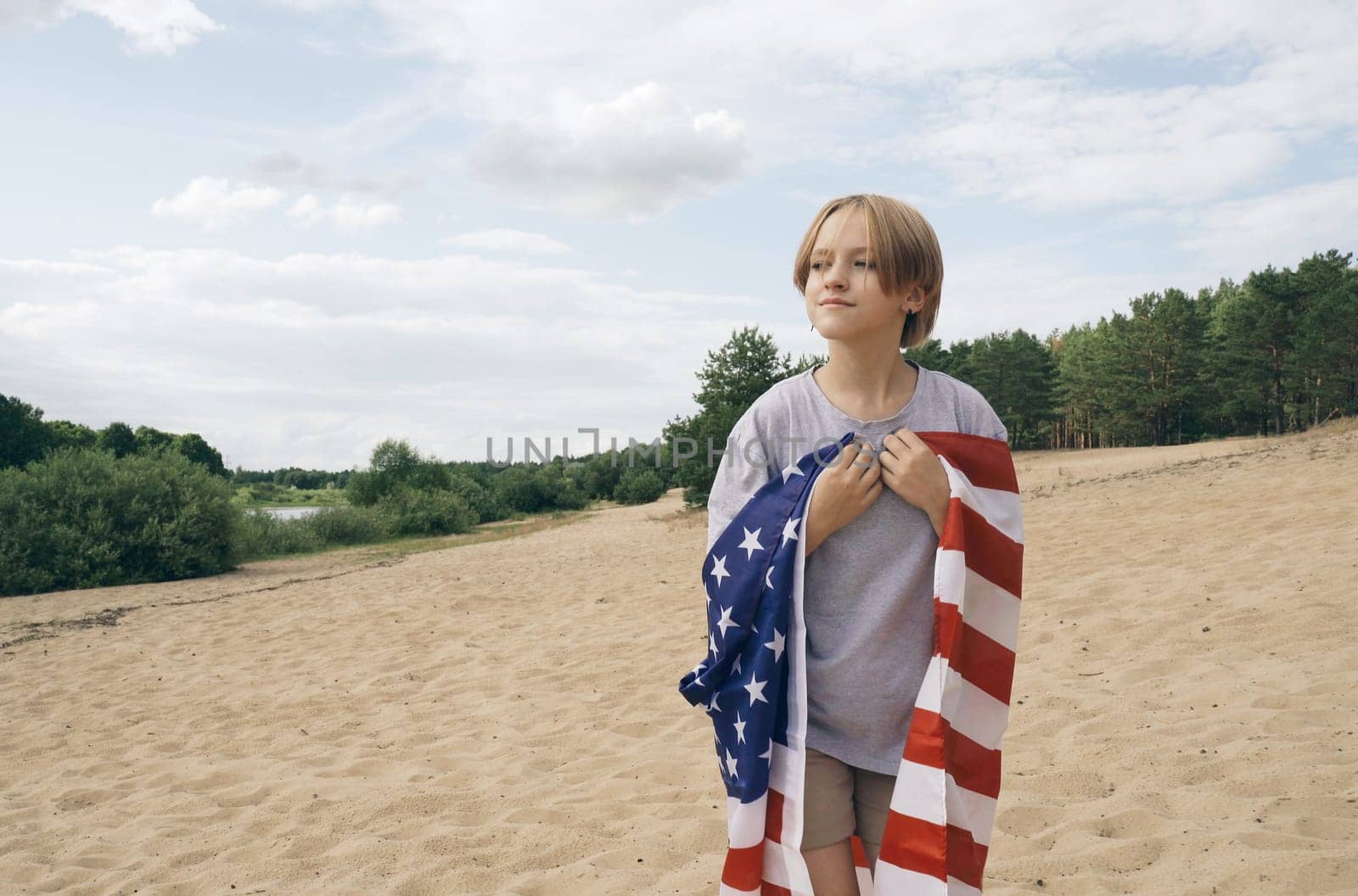 A cheerful beautiful girl is walking under the US flag, which is fluttering in the wind by Sd28DimoN_1976