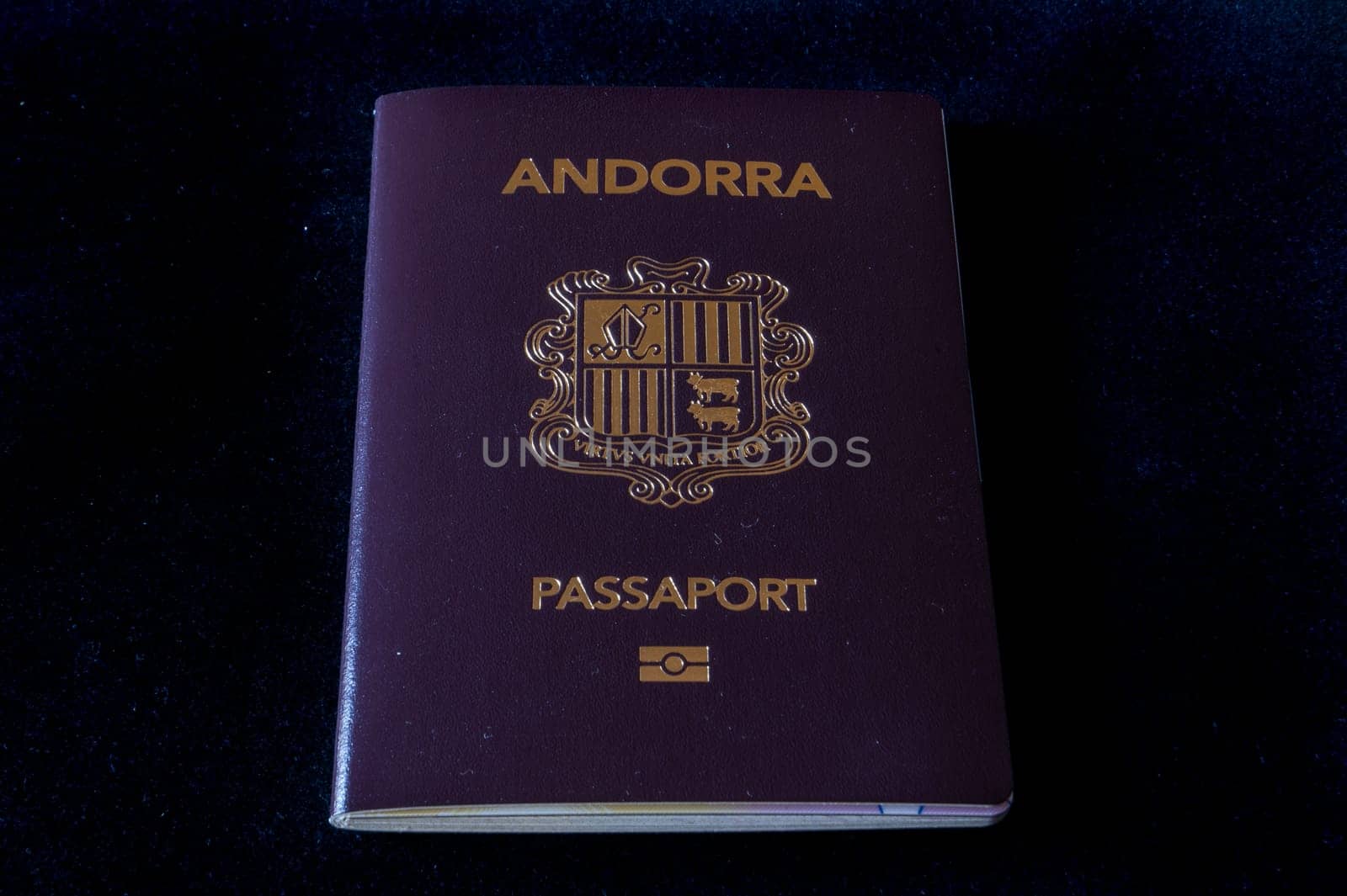 Passport of the Principality of Andorra on a black background by martinscphoto