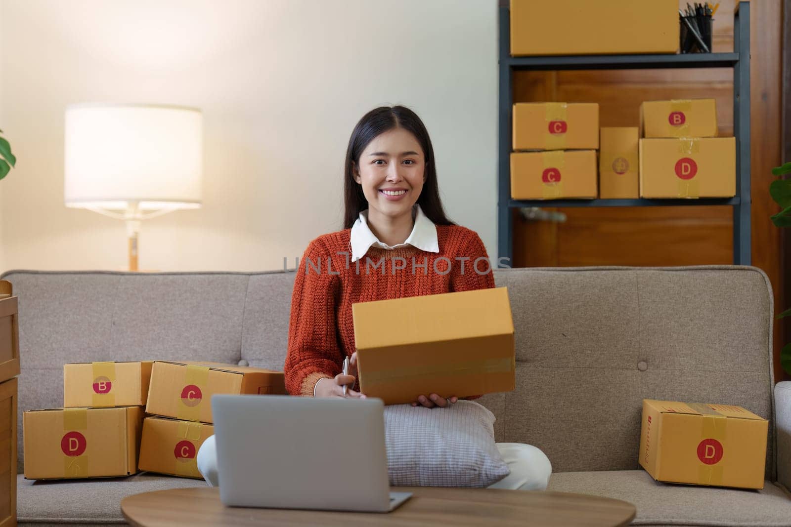 Small businesses SME owners female entrepreneurs check online orders to prepare to pack the boxes, sell to customers, sme business ideas online.