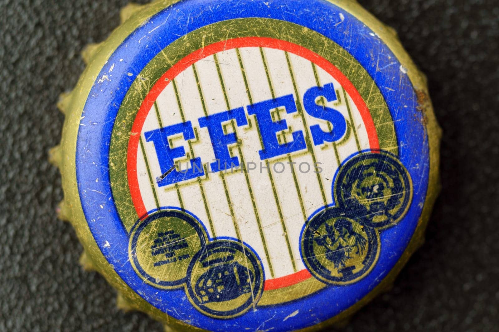 Tyumen, Russia-February 15, 2023: An old beer lid. Efes Pilsener is the flagship beer of Anadolu Efes, headquartered in Istanbul.