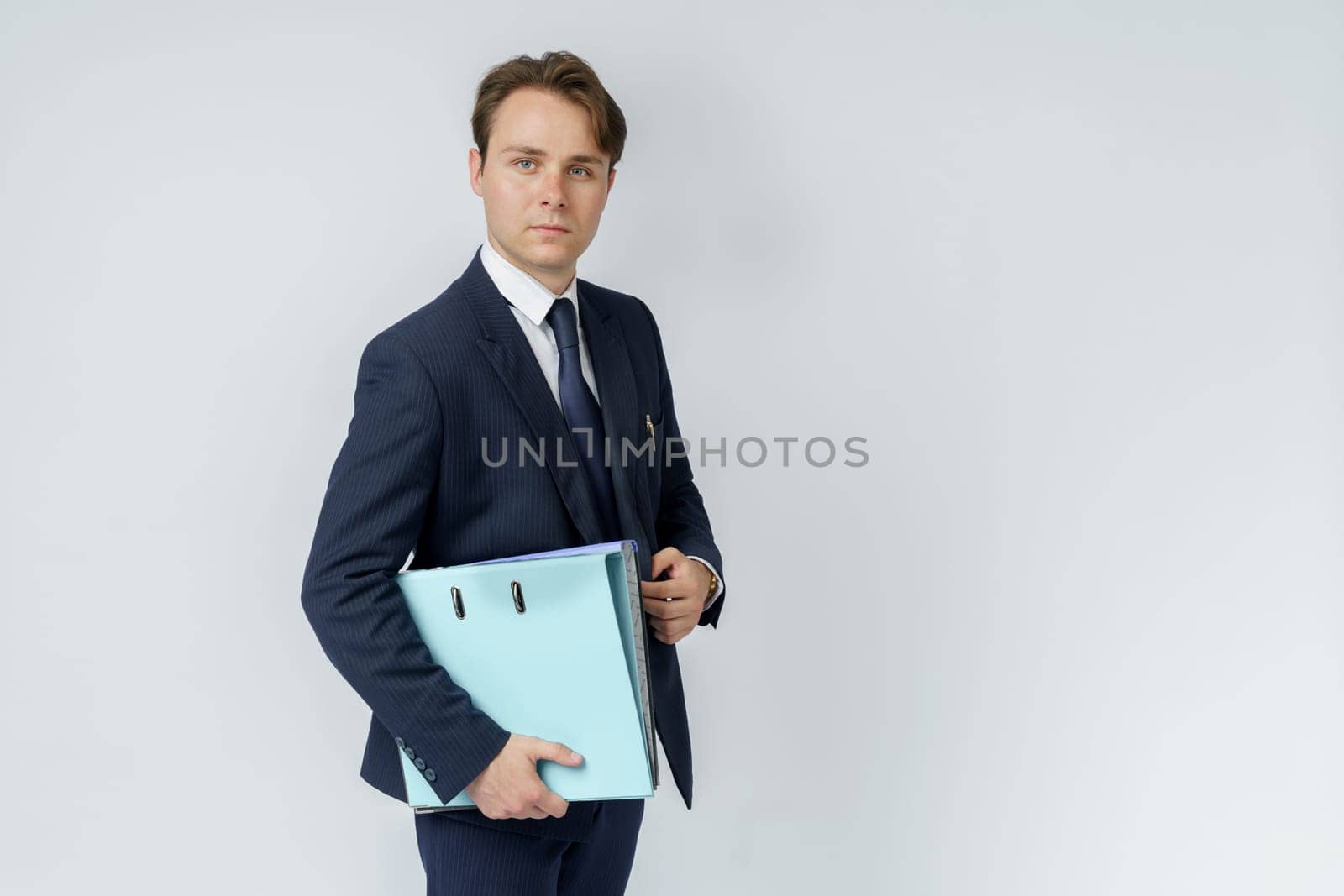 A businessman in a blue suit holds folders on a white background. by Sd28DimoN_1976