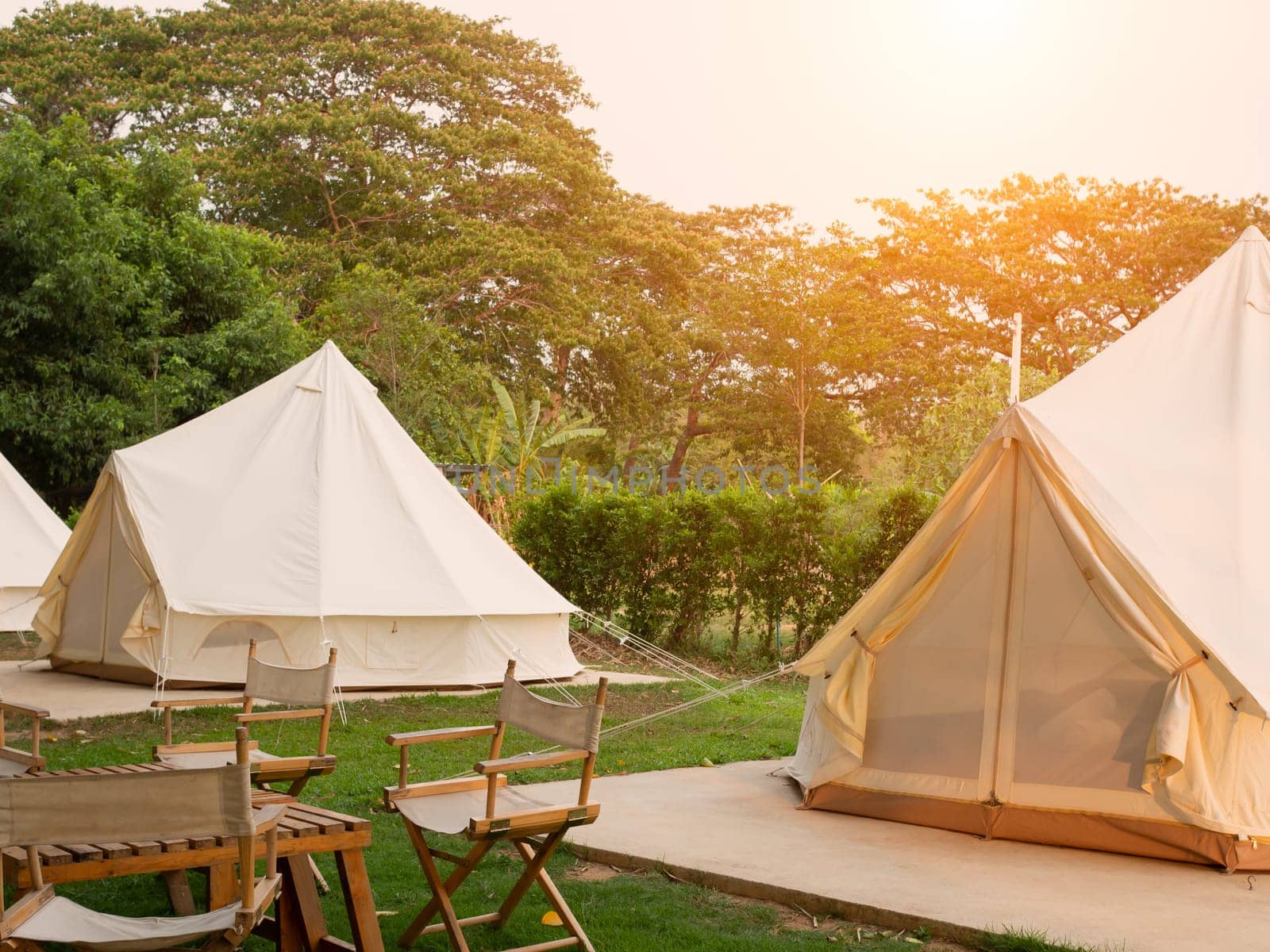 Camping picnic tent campground in outdoor hiking forest. Camper while campsite in nature background at summer trip camp. Adventure Travel Vacation concept
