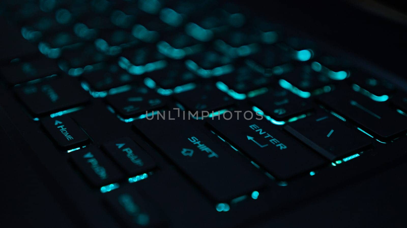 A computer keyboard is an input device that allows a person to enter letters, numbers, and other symbols keyboard with green back-light by Unimages2527