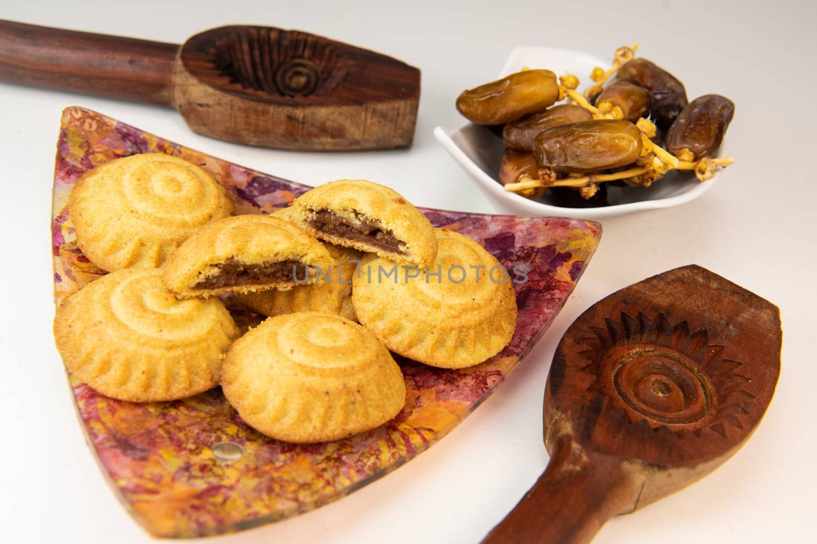 Traditional eid maamoul or mamoul cookies with dates, nuts, and jam, Arabic sweets for Aid al-Fitr and easter, High quality photo