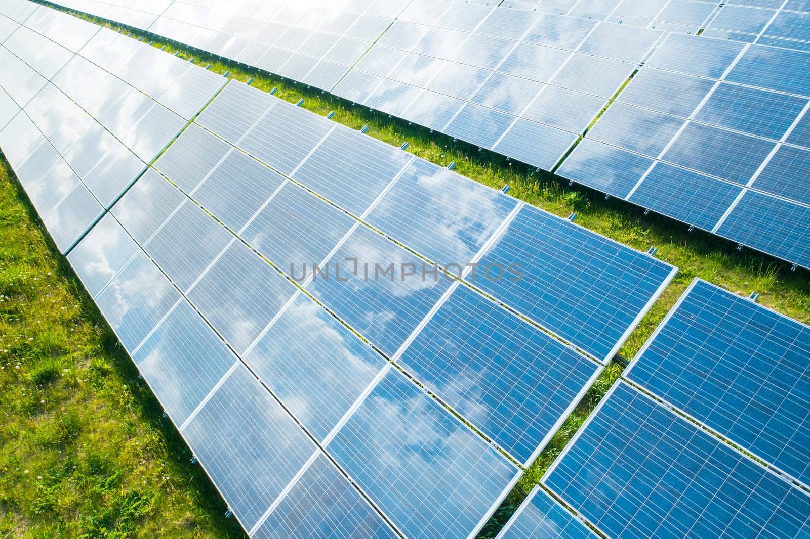 Solar panels in the green field for generation of green energy safety for environmental