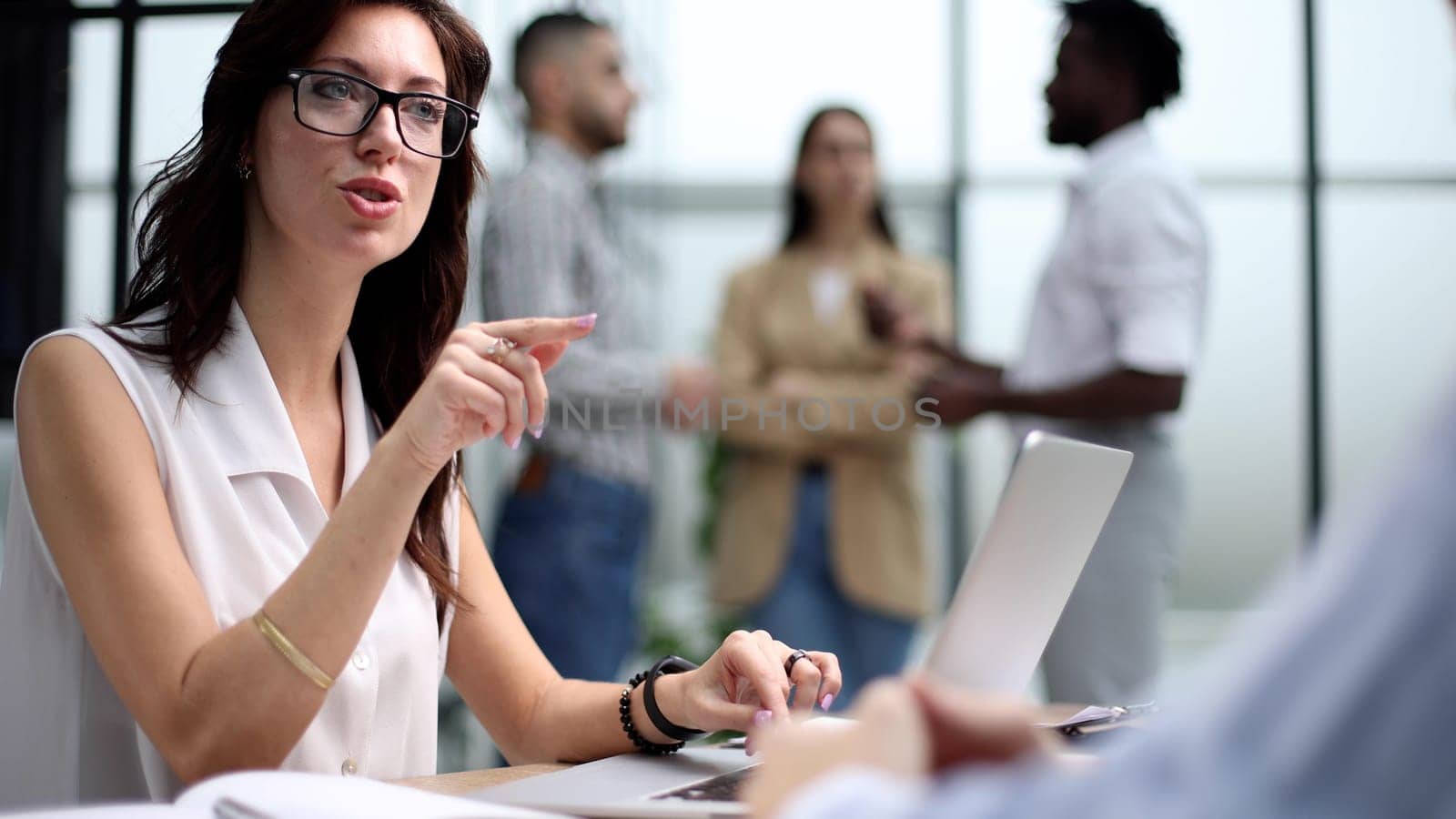Young speaker interviewing new partners in the office