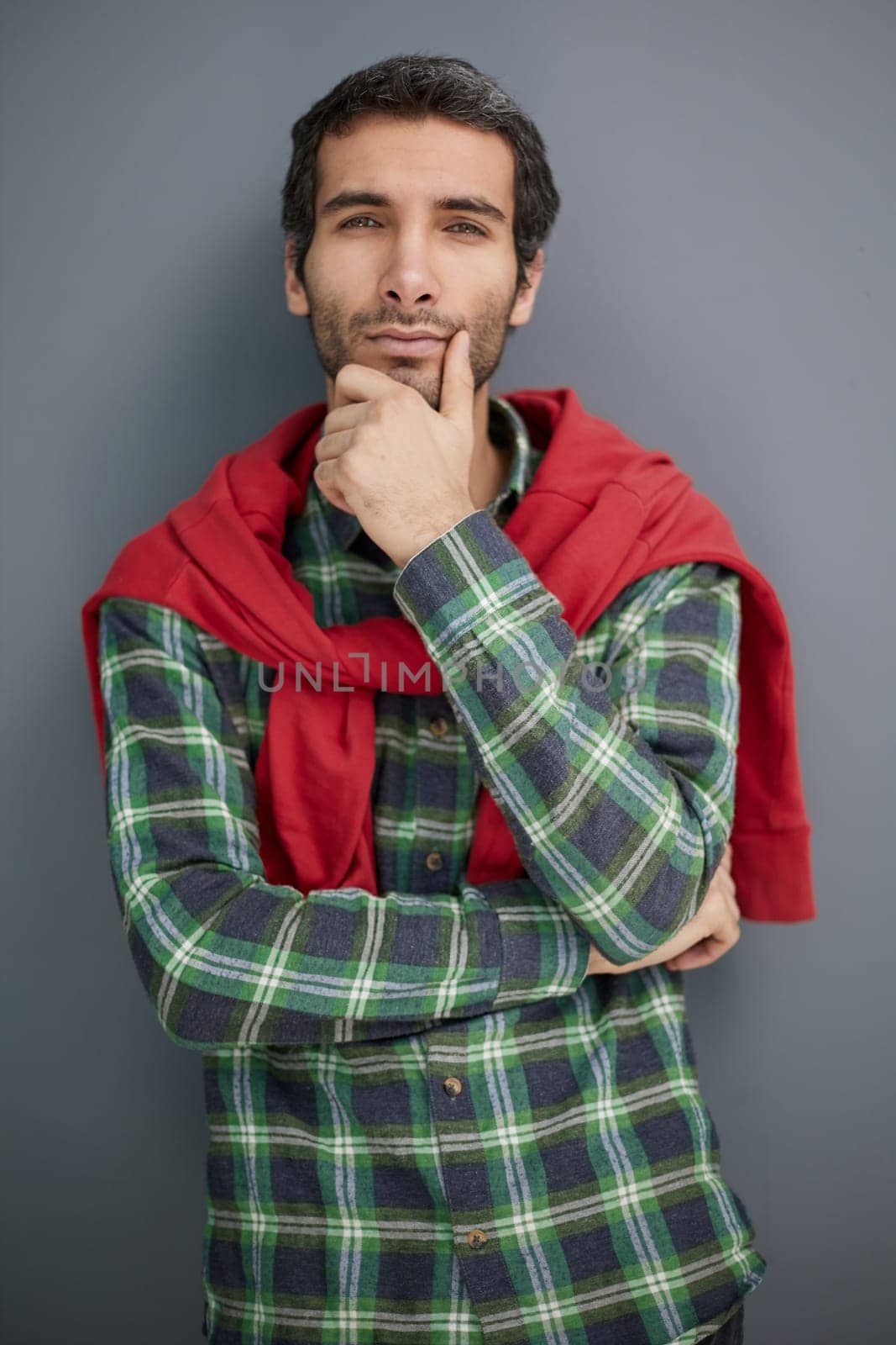 Pensive young bearded man guy in casual t-shirt, people lifestyle concept.