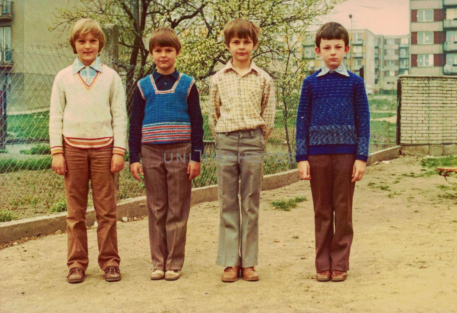 THE CZECHOSLOVAK SOCIALIST REPUBLIC - CIRCA 1980s: Retro photo shows pupils (boys) outdoors. They pose for a group photography. Color photo.
