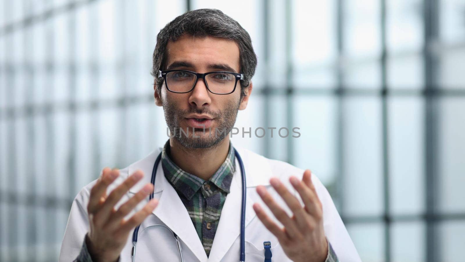 young male wearing white uniform with stethoscope speaking, consulting and therapy concept