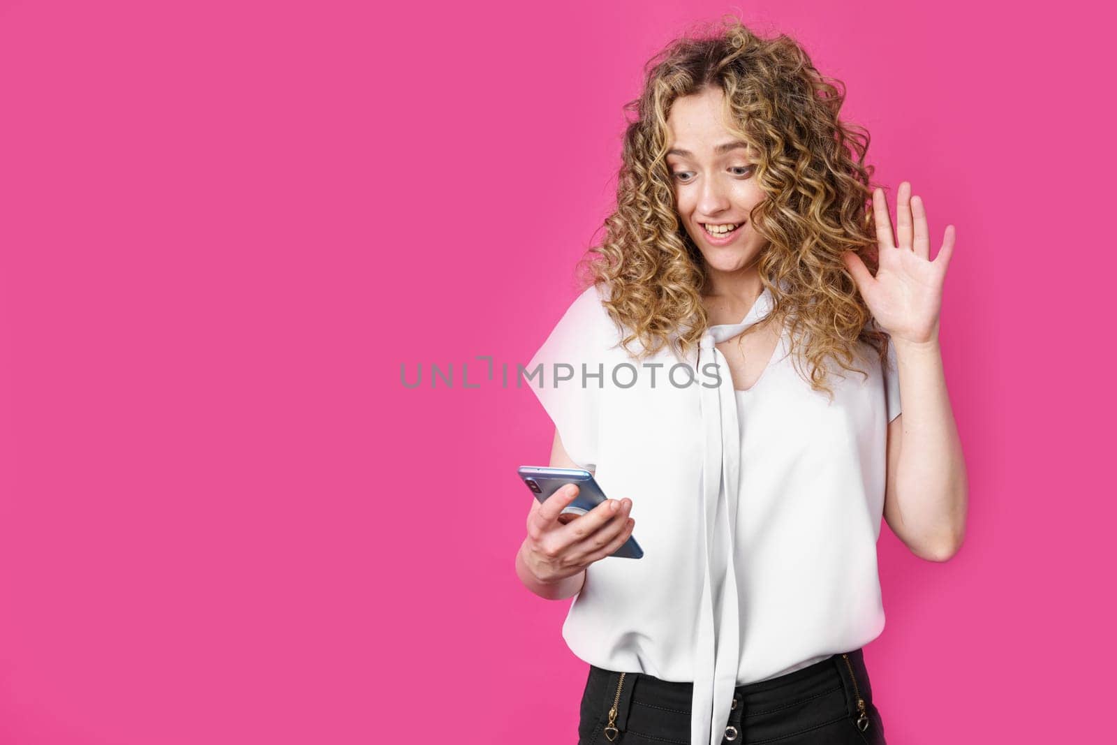 Young woman communicates through the phone by video link, expressing emotions. Female portrait. by Sd28DimoN_1976