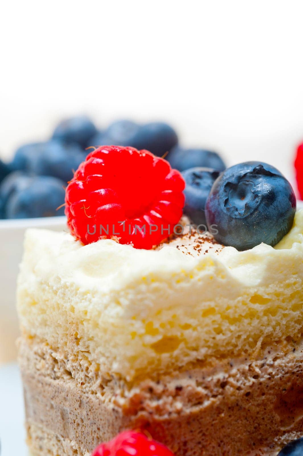 fresh homemade raspberry and blueberry cream cake 