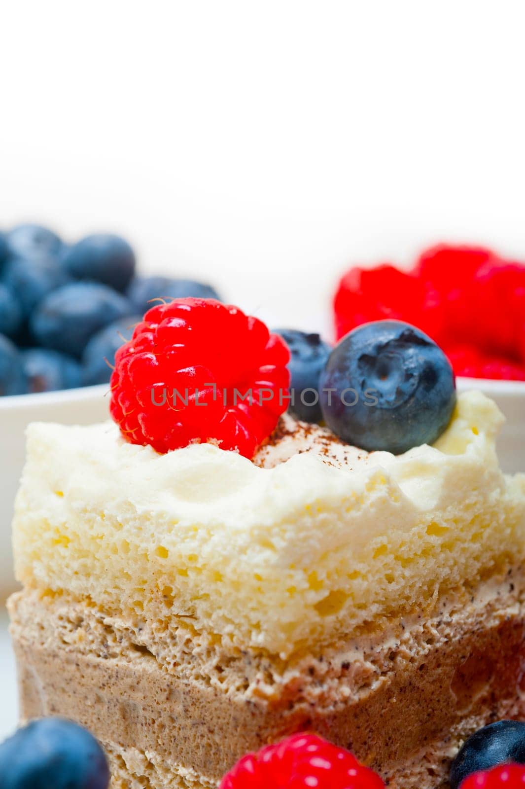 fresh homemade raspberry and blueberry cream cake 