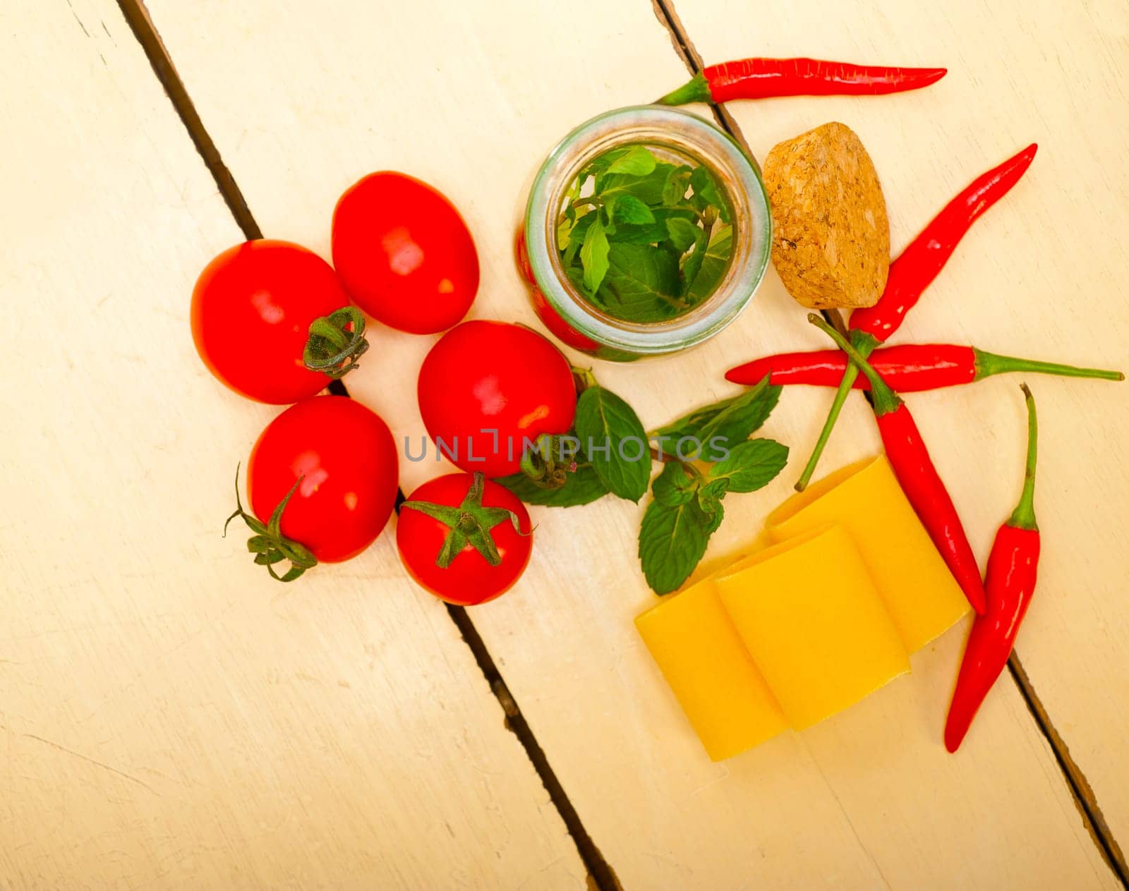 Italian pasta paccheri or schiaffoni with tomato mint and chili pepper ingredients