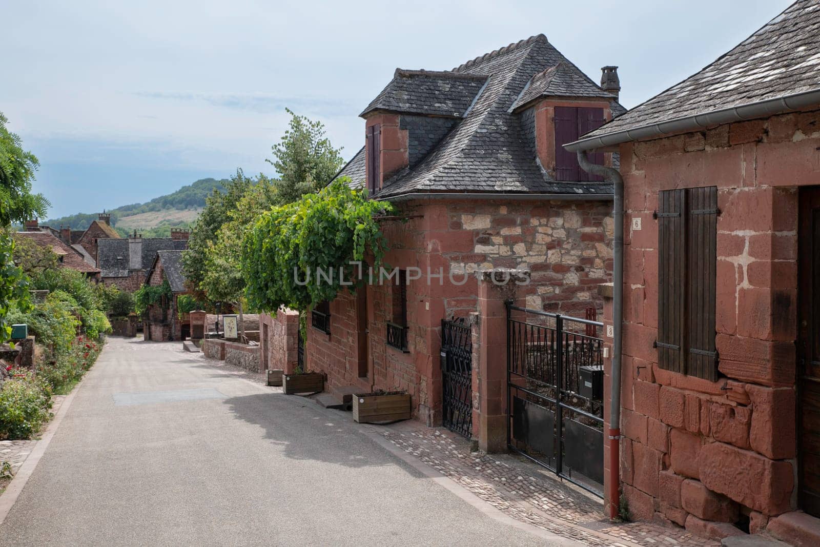 Collonges la Rouge, distinctive red brick houses and towers of the medieval Old Town, France. it is the first member of the Plus Beaux Villages de France nomination most beautiful villages of France