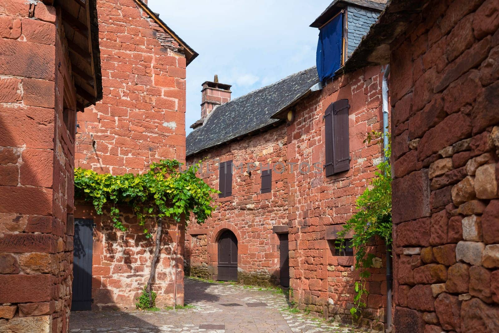 Collonges la Rouge, distinctive red brick houses and towers of the medieval Old Town, France. it is the first member of the Plus Beaux Villages de France nomination most beautiful villages of France