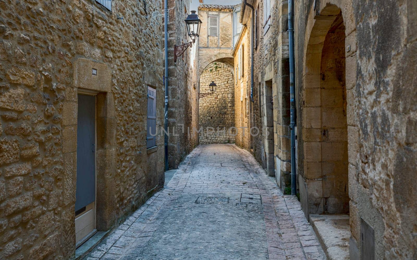 Typical narrow street in the medieval Old Town of Sarlat la Caneda, Perigord, France