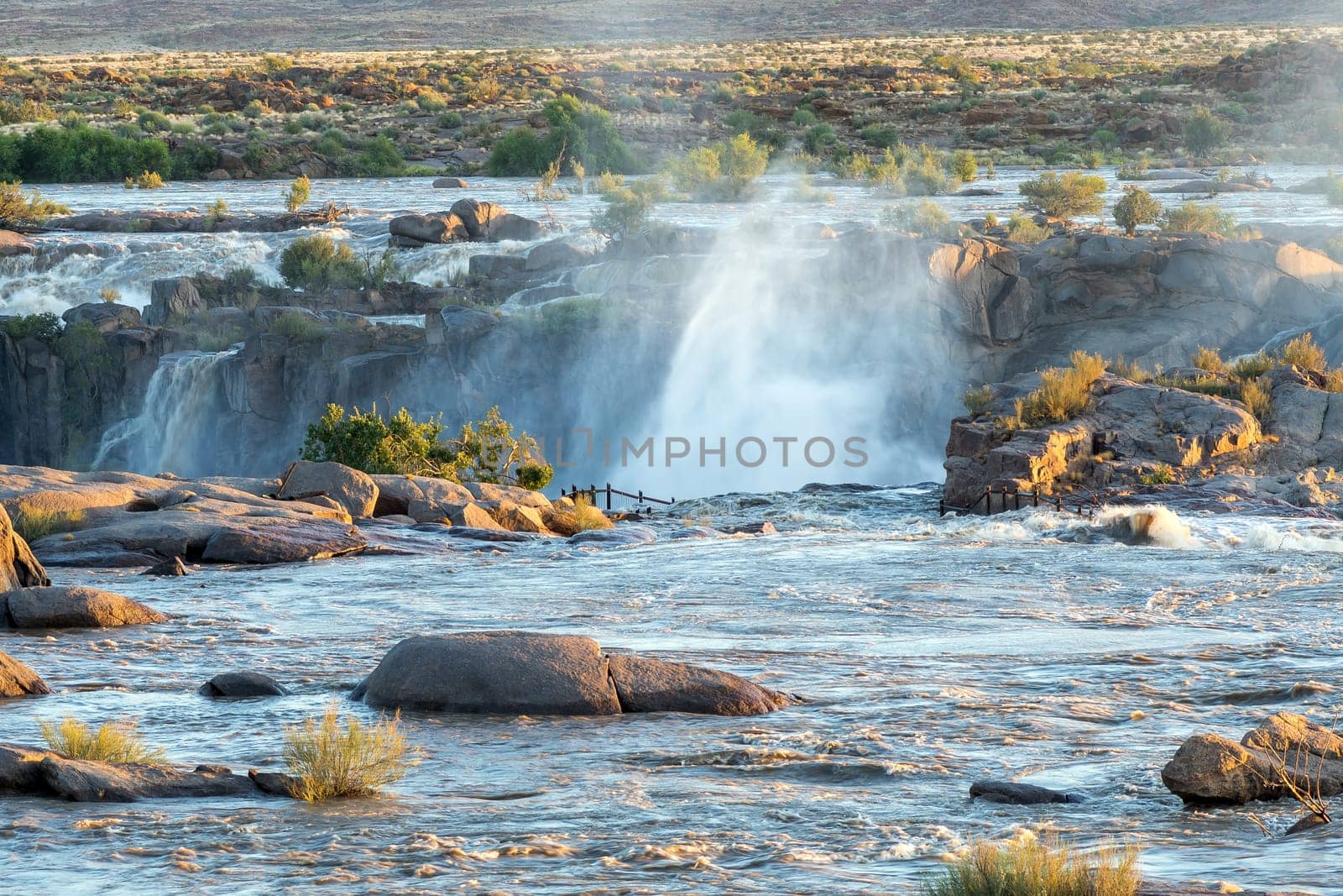 Flooded boardwalk at the main Augrabies waterfall in the Orange River.