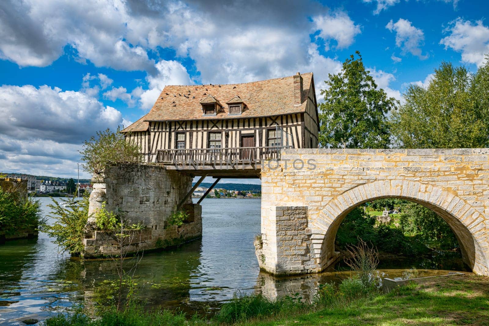 Old timbered water mill house on bridge seine river, vernon, normandy, france, europe