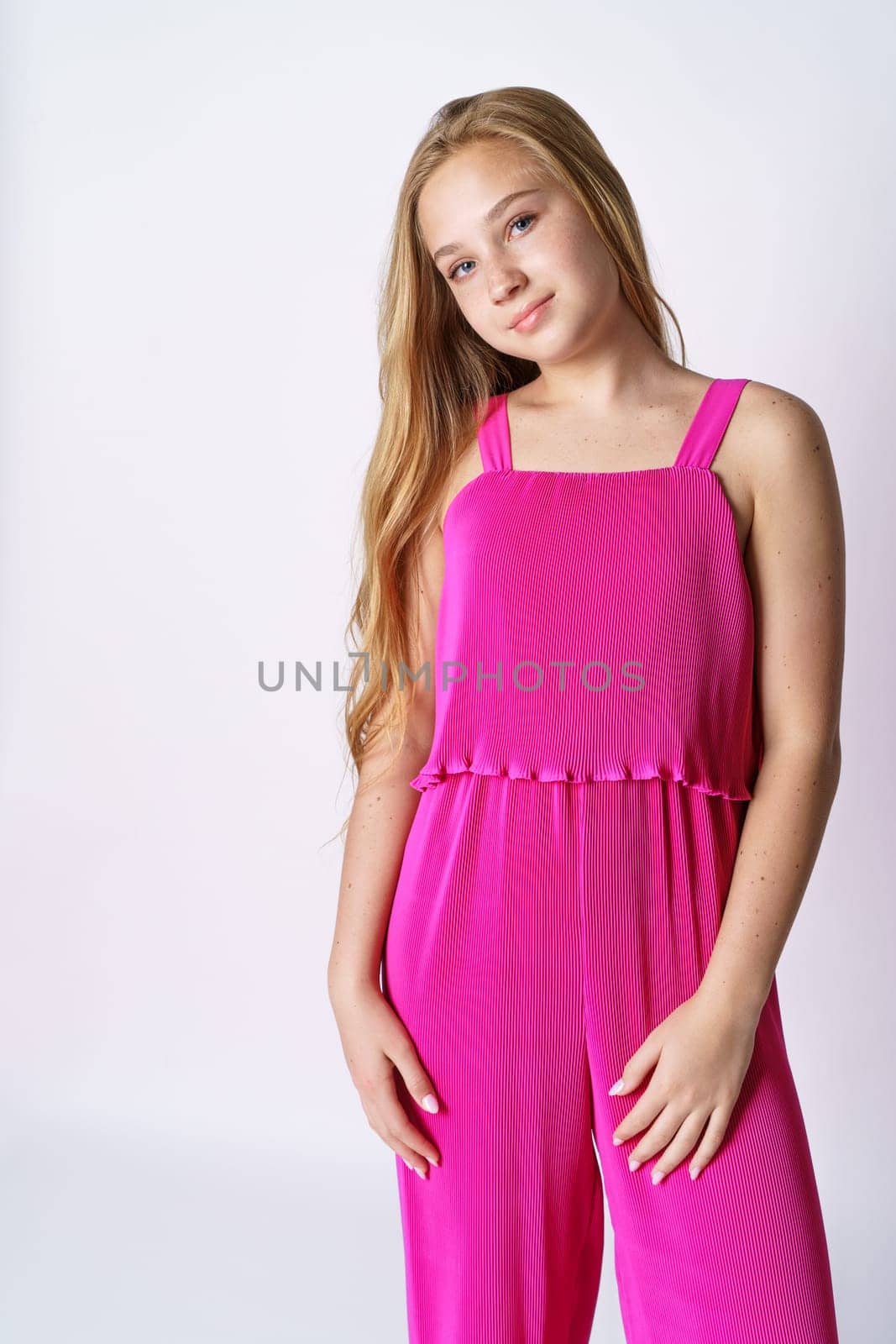 Beautiful teen girl posing in pink on a white background by EkaterinaPereslavtseva