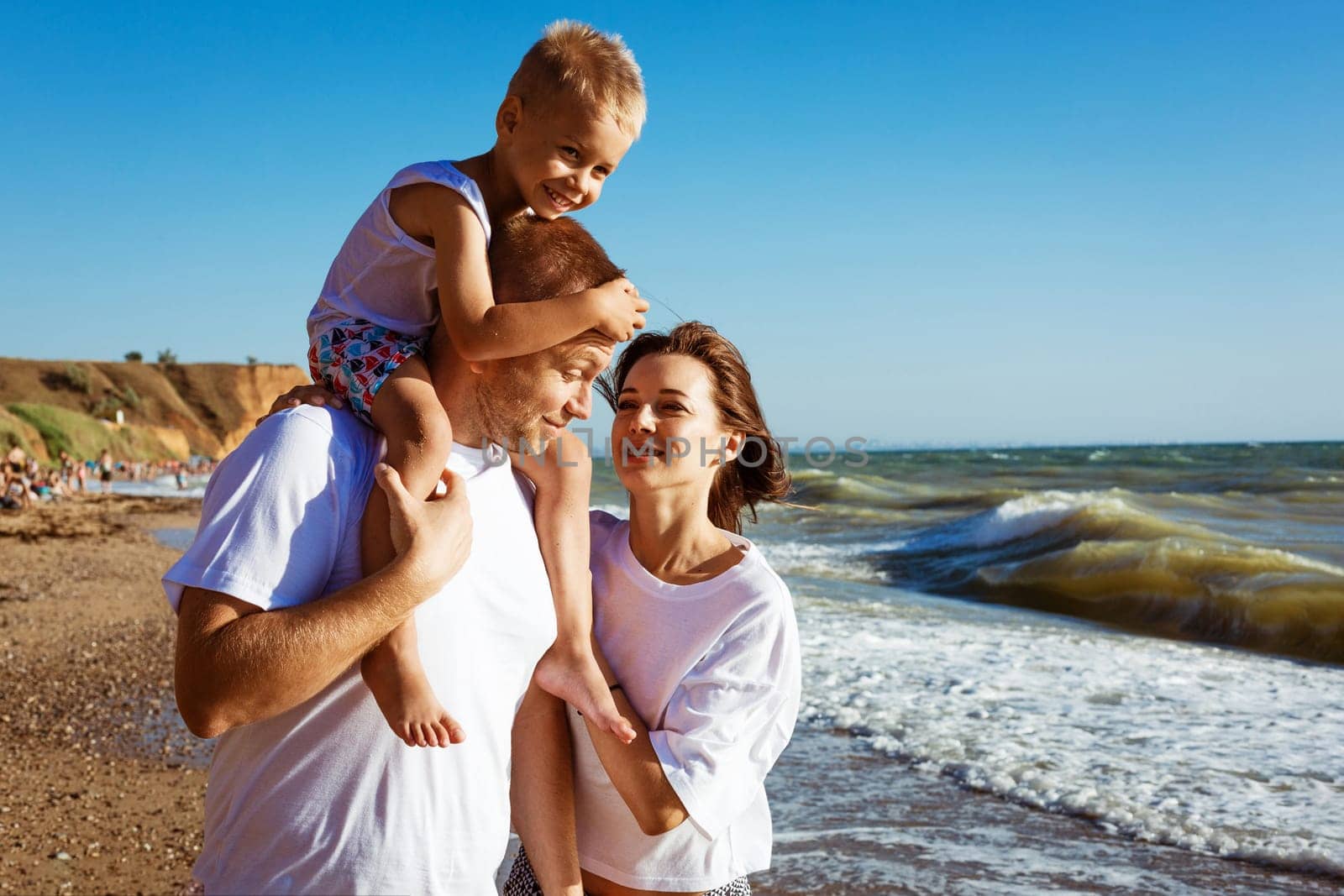 Happy family having fun on summer vacation. by EkaterinaPereslavtseva